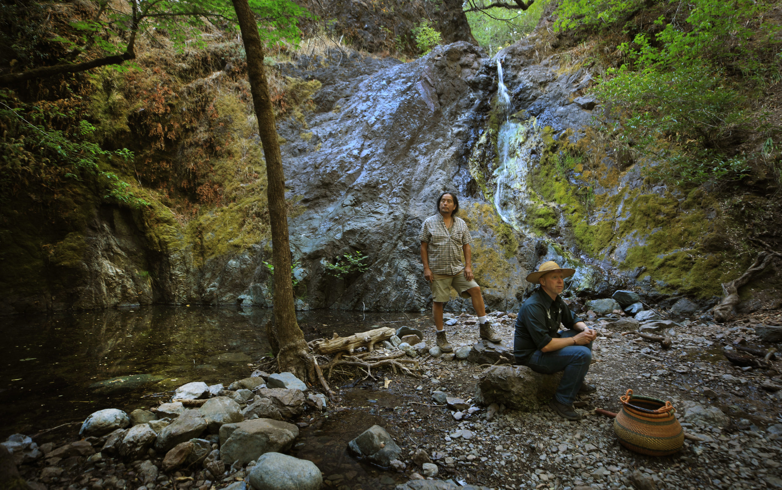 At Bohemia Preserve near Occidental, Coby Liebman and his foraging partner Redbird pause at the preserve's waterfall. (Kent Porter / The Press Democrat) 2021