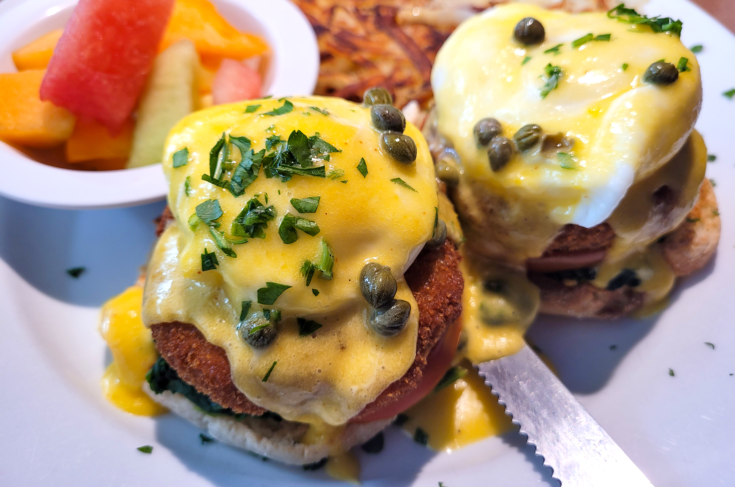 Colibri Grill Crab Cake Benedict breakfast made with crab cakes, spinach, tomatoe and Hollandaise in Santa Rosa. Photo, Heather Irwin/ Sonoma Magazine