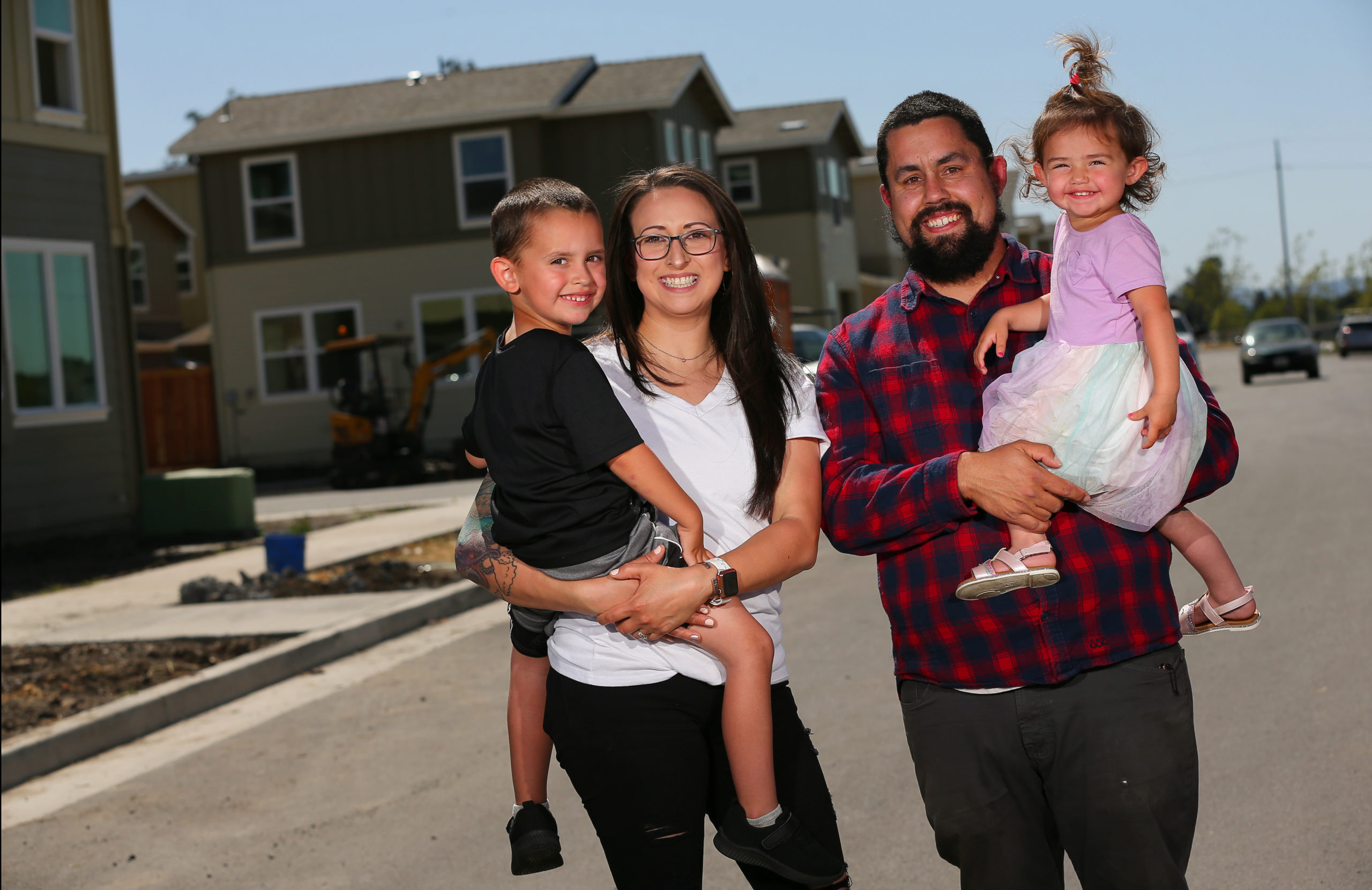Stephanie and Greg Basurto, with their children Erich, 4, and Sheby, 2, purchased a duet style single family home at the Lantana Homes community by Burbank Housing Development Corporation in Santa Rosa. (Christopher Chung/ The Press Democrat)