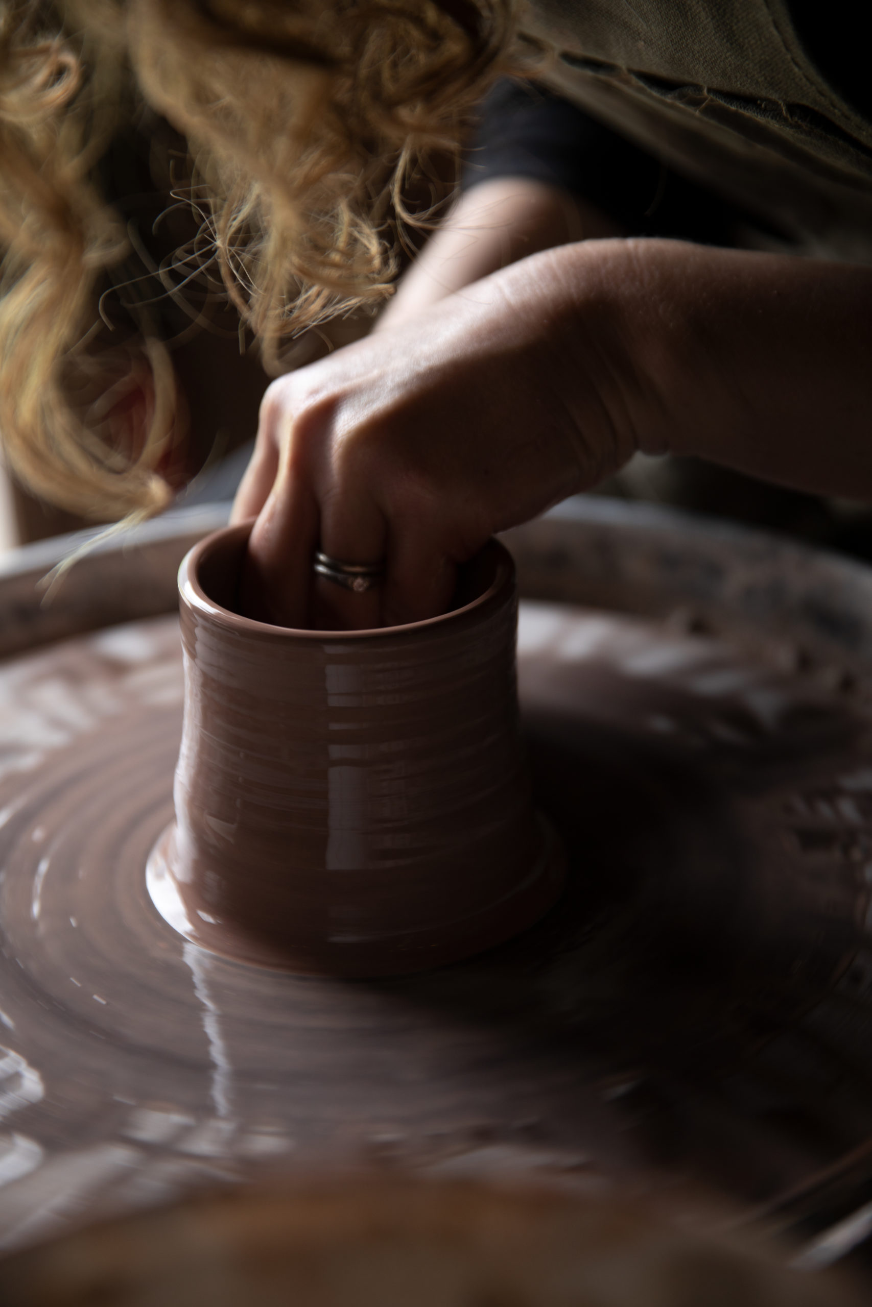 Heather Fordham works at the potter's wheel. (Paige Green)