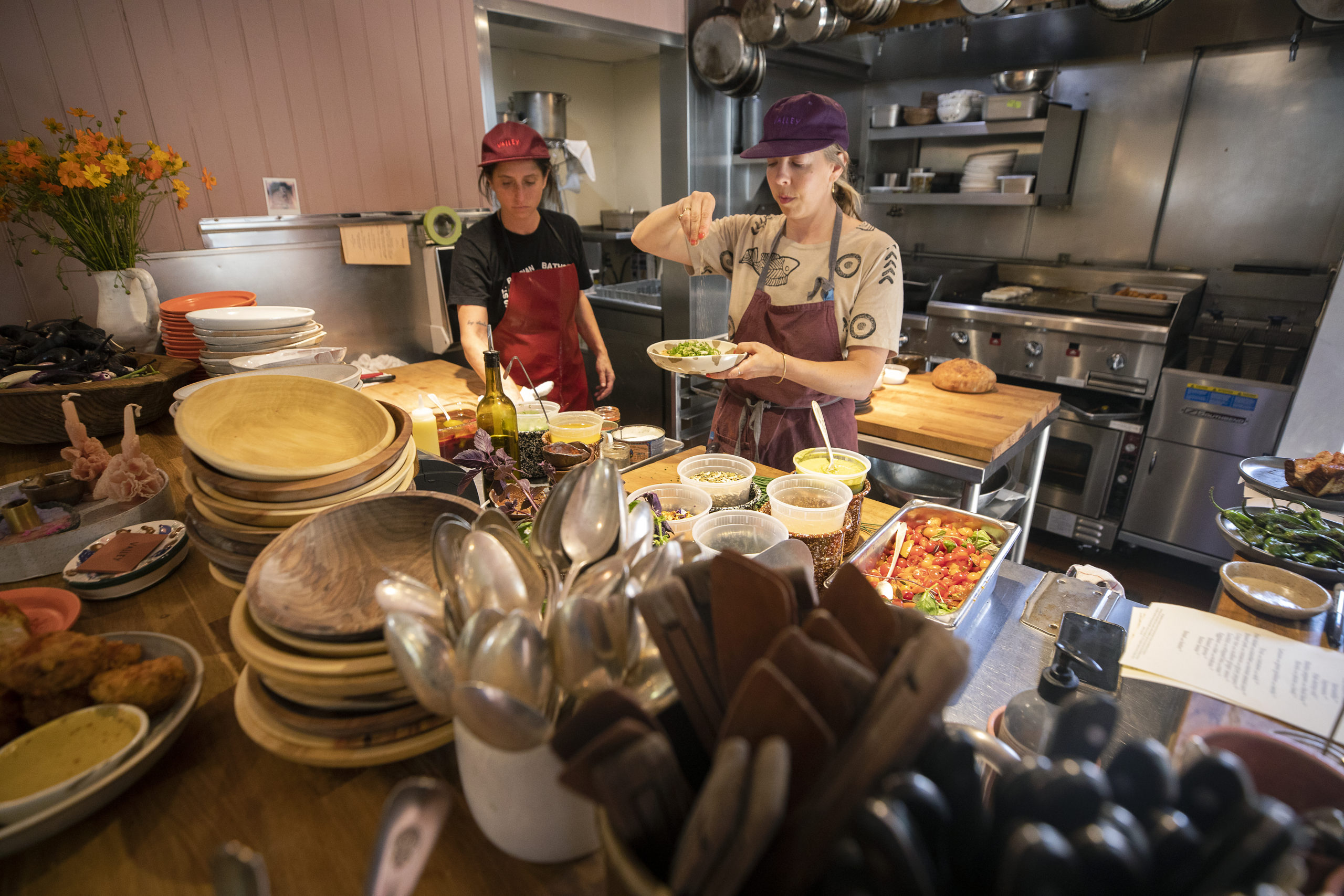 Chefs Stephanie Reagor, left, and Emma Lipp in the open kitchen at Valley Bar + Bottle on the Sonoma Square. Valley earned a James Beard nod.