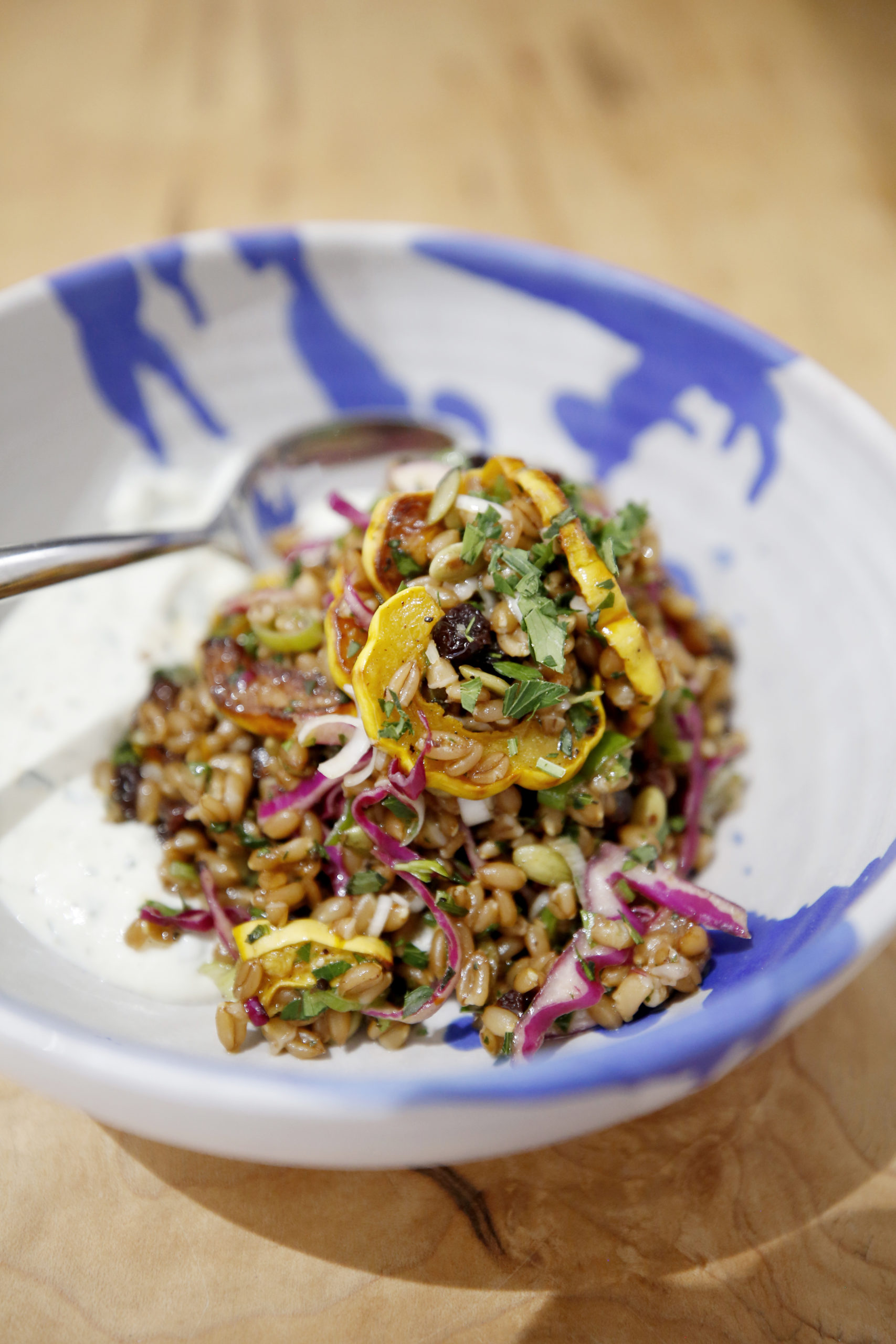A faro salad with roasted delicata squash, red cabbage, scallions, pipits, fresh herbs, with whipped feta cheese and an apricot jam dressing at Miracle Plum in Santa Rosa, Calif., on Tuesday, July 6, 2021.(Beth Schlanker/The Press Democrat)
