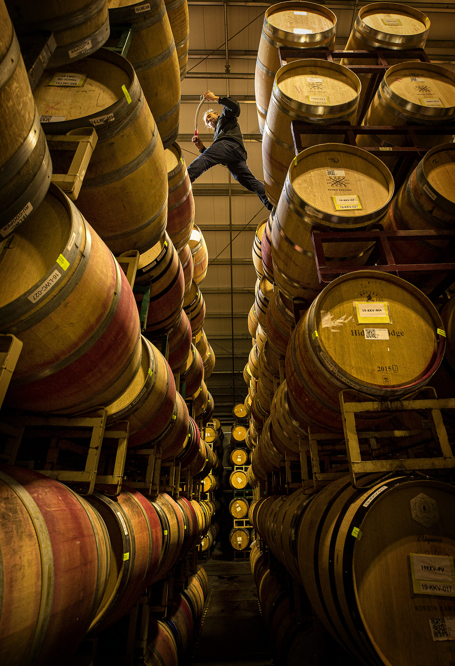 Chris Leonard, owner of the Leonard Wine Company, takes samples from 40 different barrels for blending trials at the Sugarloaf Crush facility in Oakmont. (photo by John Burgess/Sonoma Magazine)