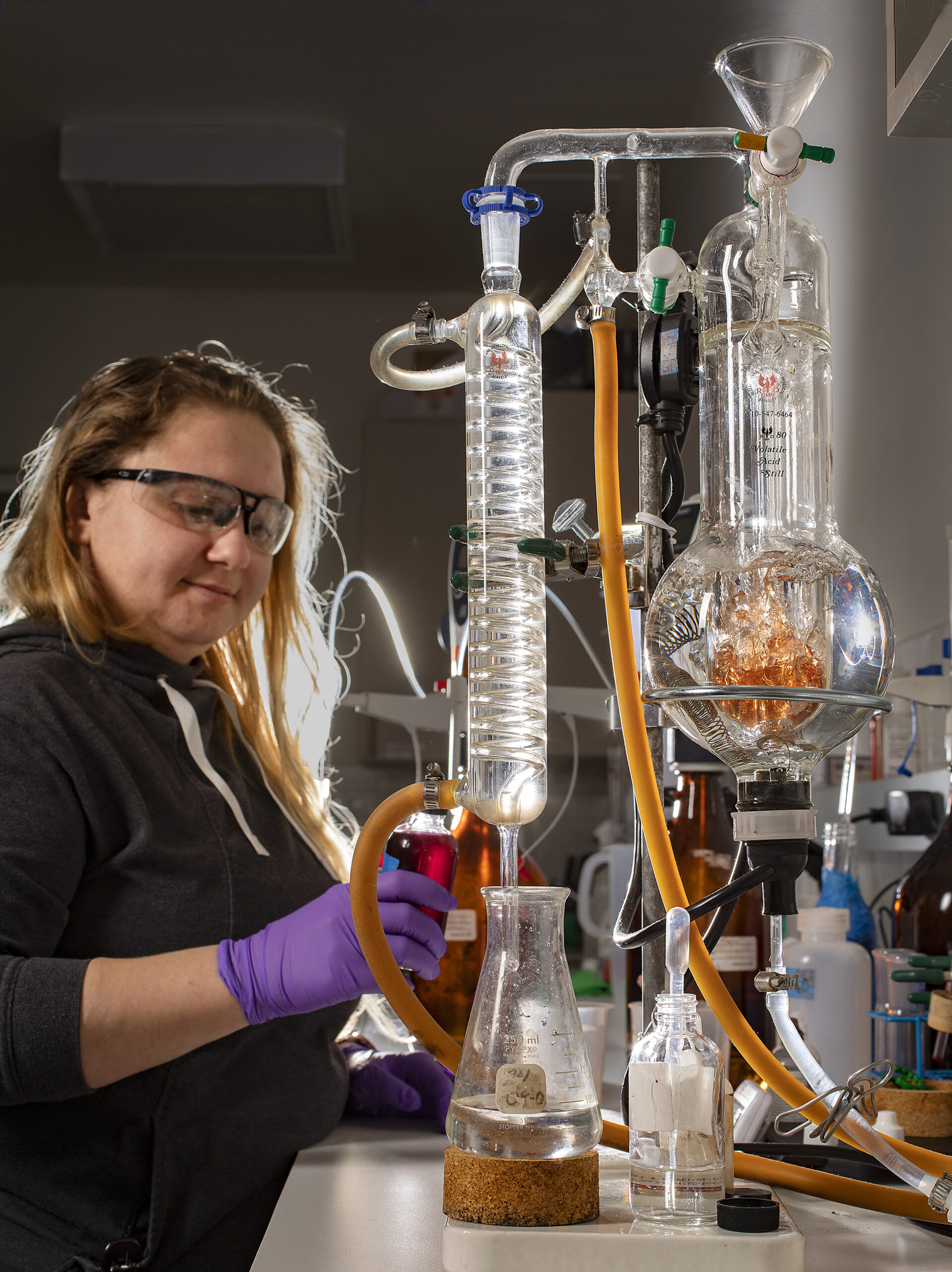 Jessica Yeates, the enologist for VML and Truett Hurst wineries, uses a still to titrate wine to measure the volatile acidity levels in the lab at the Sugarloaf Crush facility in Oakmont. (photo by John Burgess/Sonoma Magazine)