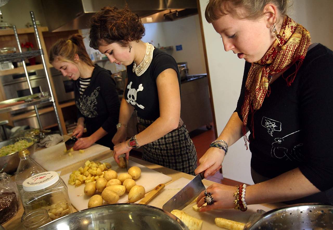 Right to left, Anna Stuffelbeam, 18, Mathilde Amiot, 18, and Ursule Amiot, 16, prepare healthy meals for cancer patients throughout Sonoma County with the Ceres Community Project in Sebastopol. (John Burgess/The Press Democrat)