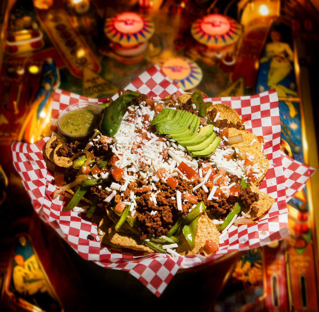 ChoriVegan nachos with black beans, vegan chorizo, vegan mozzarella cheese, bell peppers, avocado, vegan sour cream, diced green onions, dice tomatoes, chopped cilantro, avocado and green salsa from the Tacos Tijuana food truck at Shady Oak Barrel House in Santa Rosa on Friday, Oct. 22, 2021. (Photo by John Burgess/The Press Democrat)