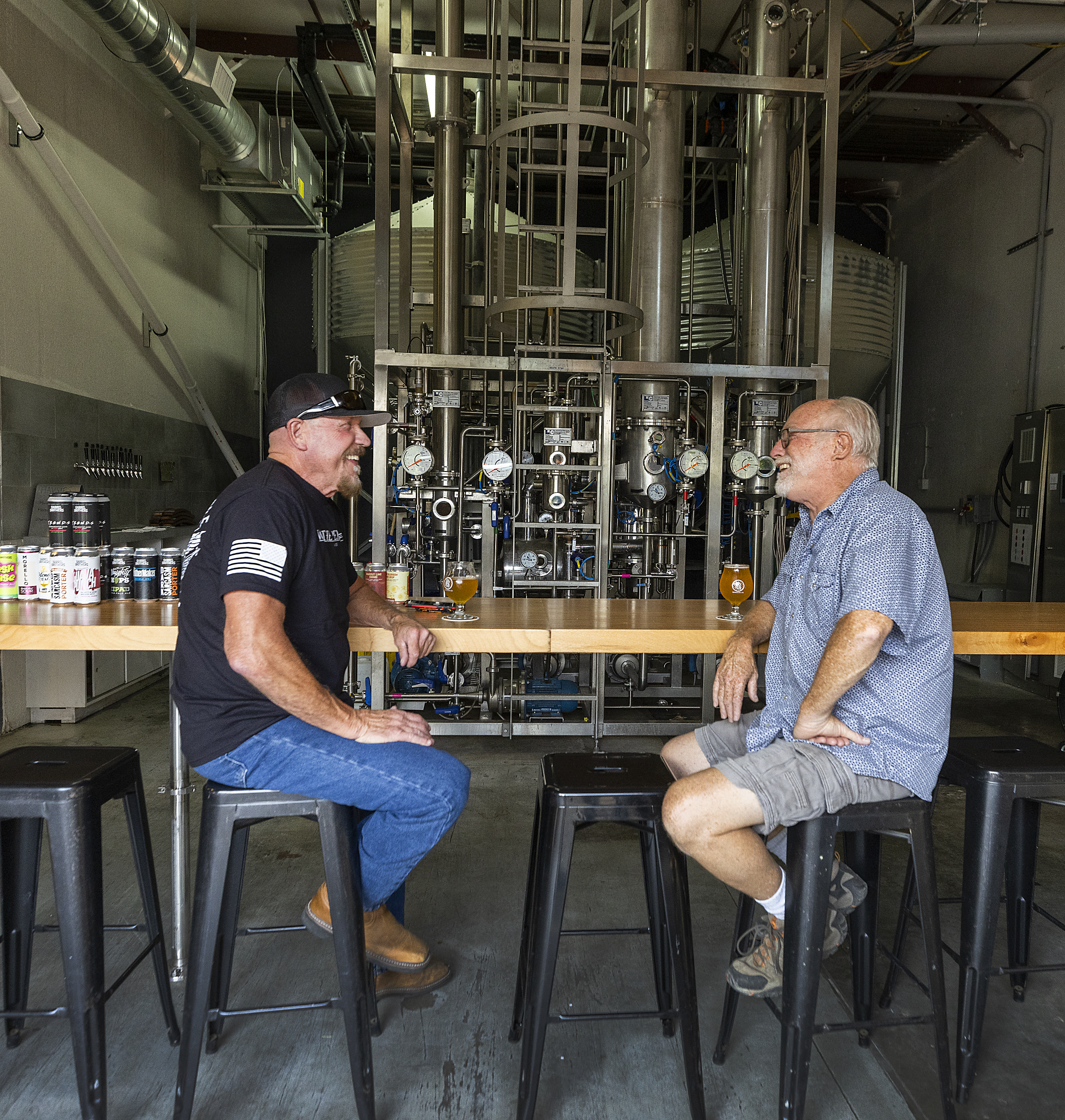 Regulars Gary Covey, left, and Andy Adams talk over a beer at Barrel Brothers Brewing Co. in Windsor on Wednesday, September 15, 2021. (Photo by John Burgess/The Press Democrat)