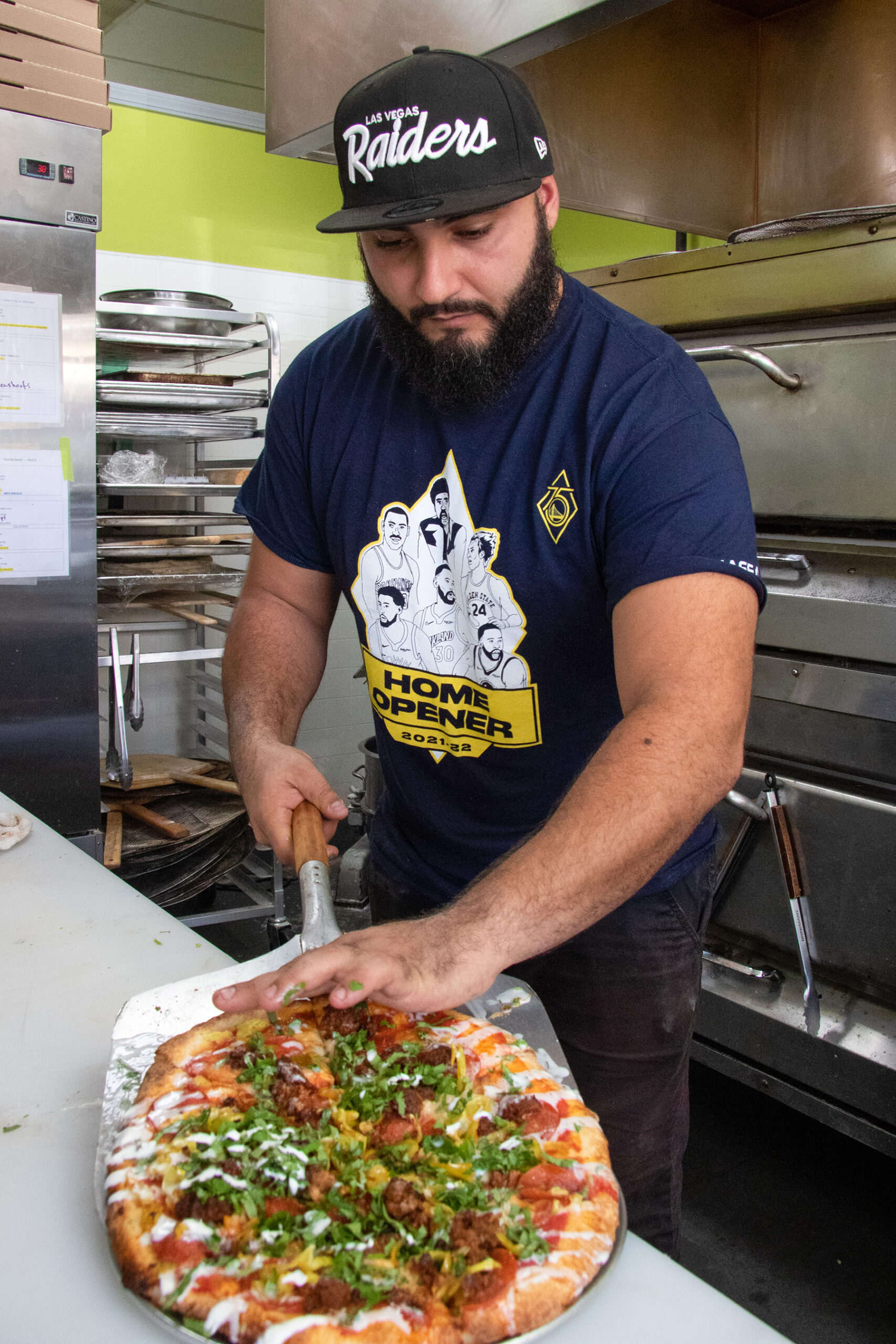 Dino Moniodis of Zimi on Mission with a completed pizza. Heather Irwin, Press Democrat