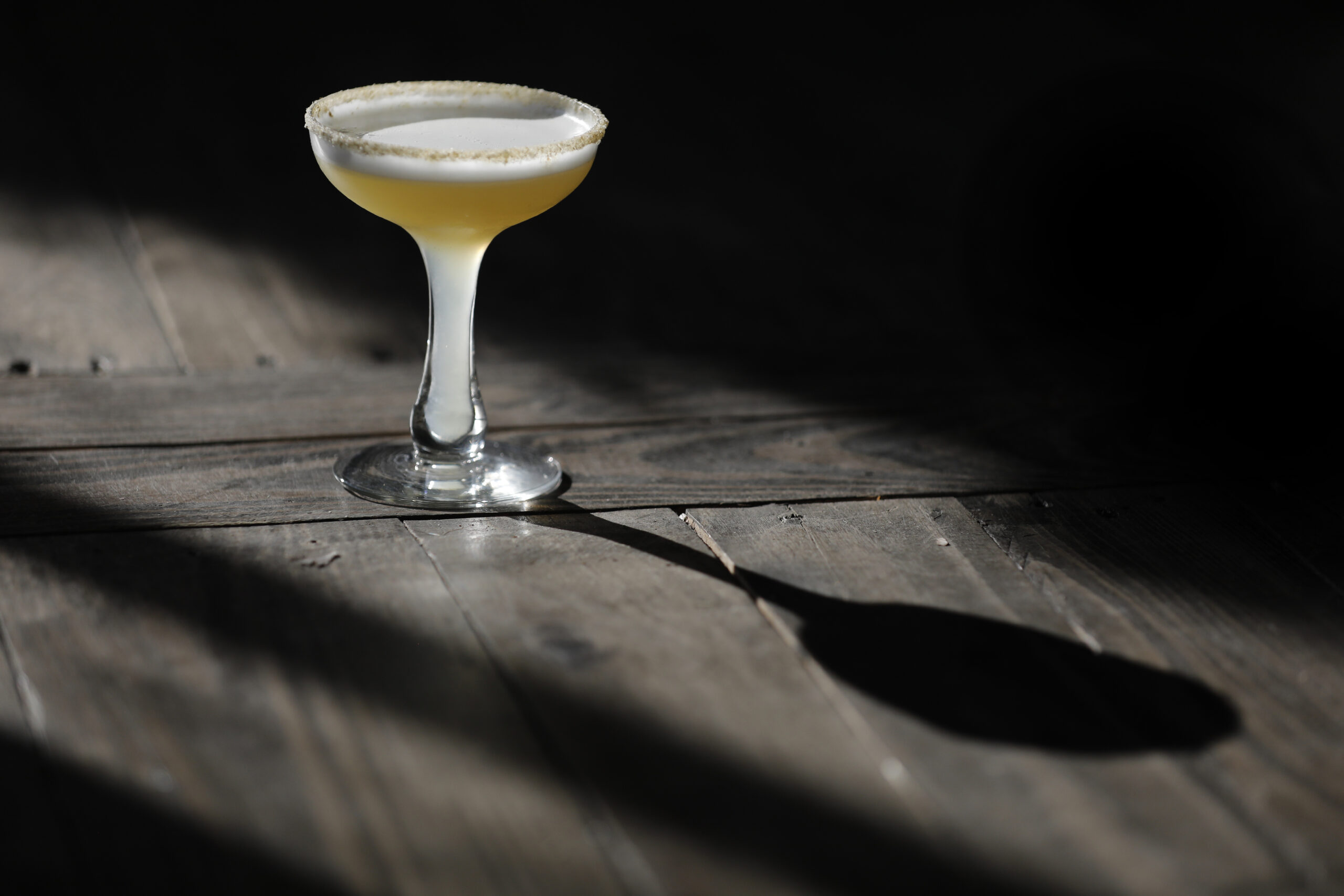 A Sicilian Sting, a mix of grappa, honey, lemon juice, egg white, with a chamomile sugar rim, at Barber Lee Spirits in Petaluma, Calif., on Thursday, December 2, 2021.(Beth Schlanker/The Press Democrat)