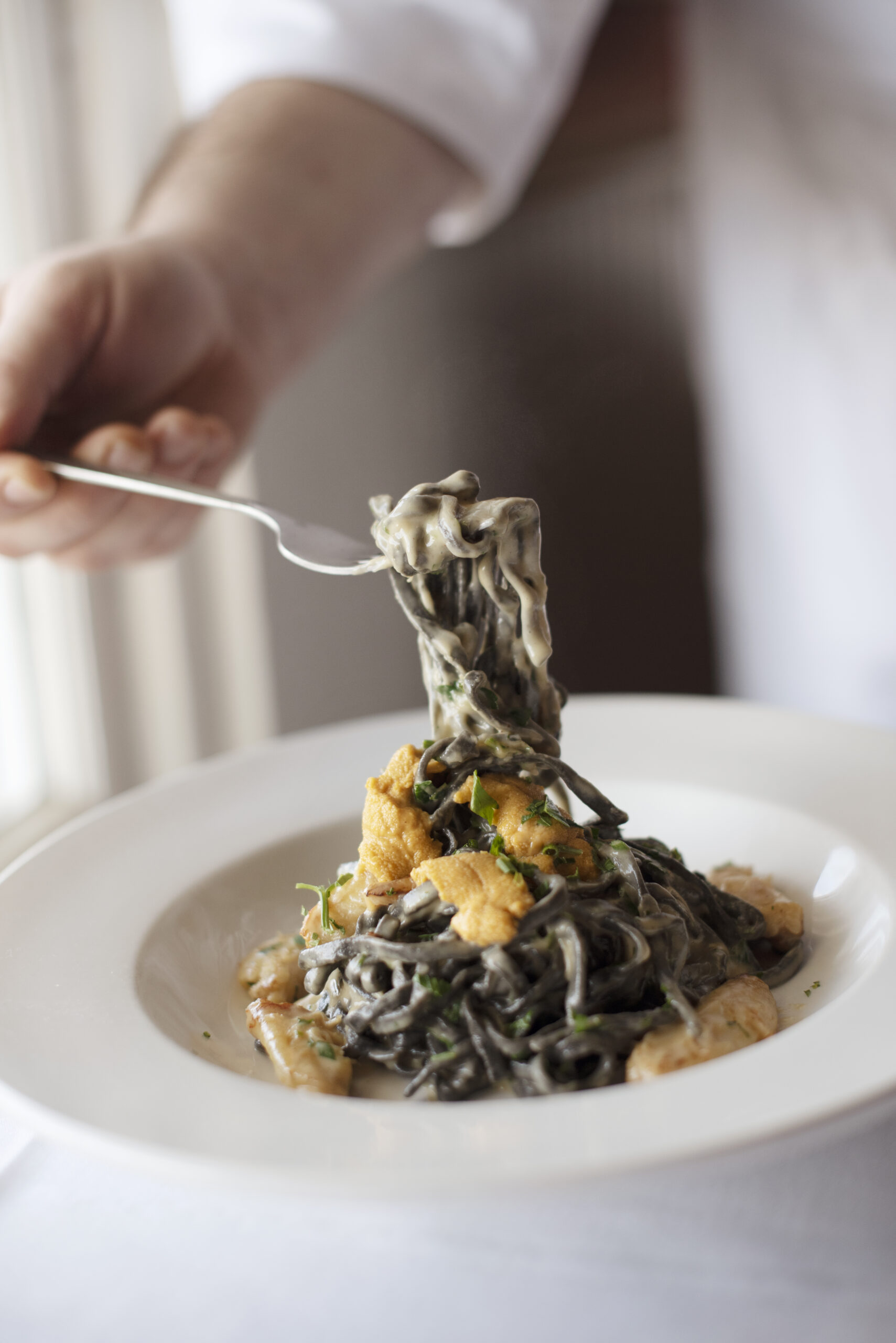 Chef de Cuisine Jason AzevedoÕs pasta with purple sea urchins and Dungeness crab at Little River Inn Restaurant in Little River, California. September 22, 2021. (Photo: Erik Castro/for Sonoma Magazine)