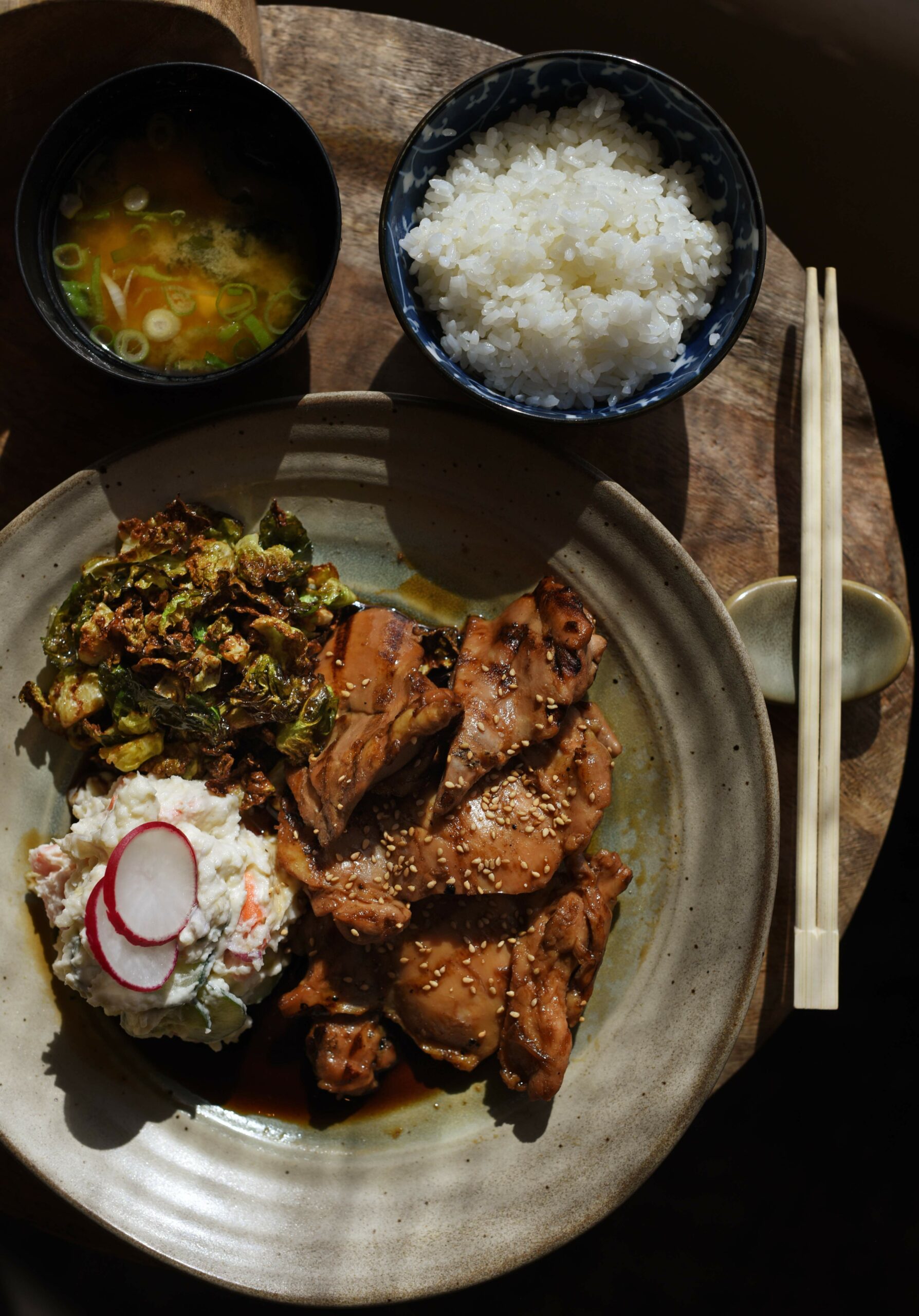 Jidori Teriyaki chicken with Japanese style potato salad and fried brussels sprouts served with a side of miso soup and rice at Hana Japanese Restaurant in Rhonert Park, Calif., on Tuesday, April 28, 2020. (Photo: Erik Castro/for The Press Democrat)