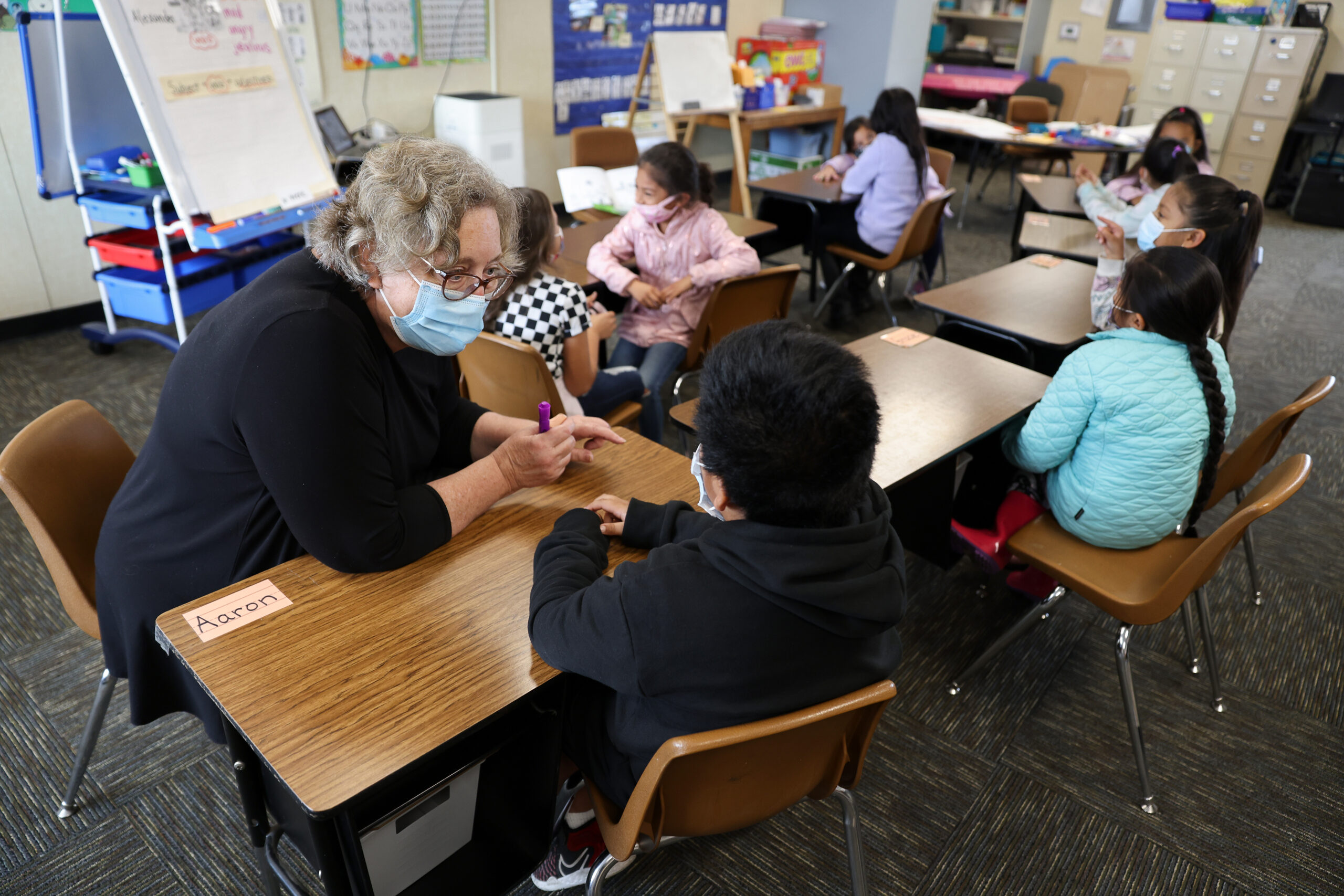 Teacher Elizabeth Olah works with a student during an English language development class at Mattie Washburn Elementary School in Windsor on Tuesday, November 2, 2021. (Christopher Chung/ The Press Democrat)