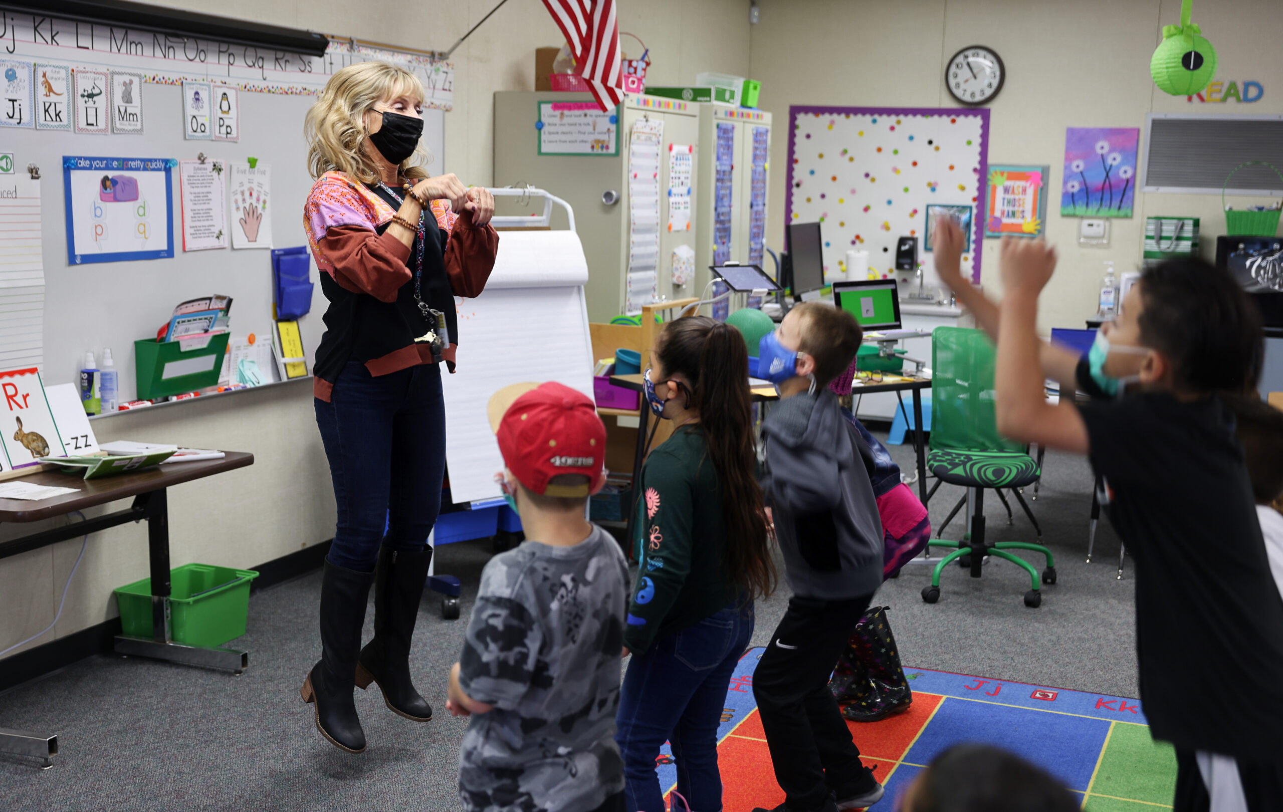 Teacher Jen Grady has her class hop like rabbits while teaching them the letter R in her reading intervention class at Mattie Washburn Elementary School in Windsor on Tuesday, November 2, 2021. (Christopher Chung/ The Press Democrat)