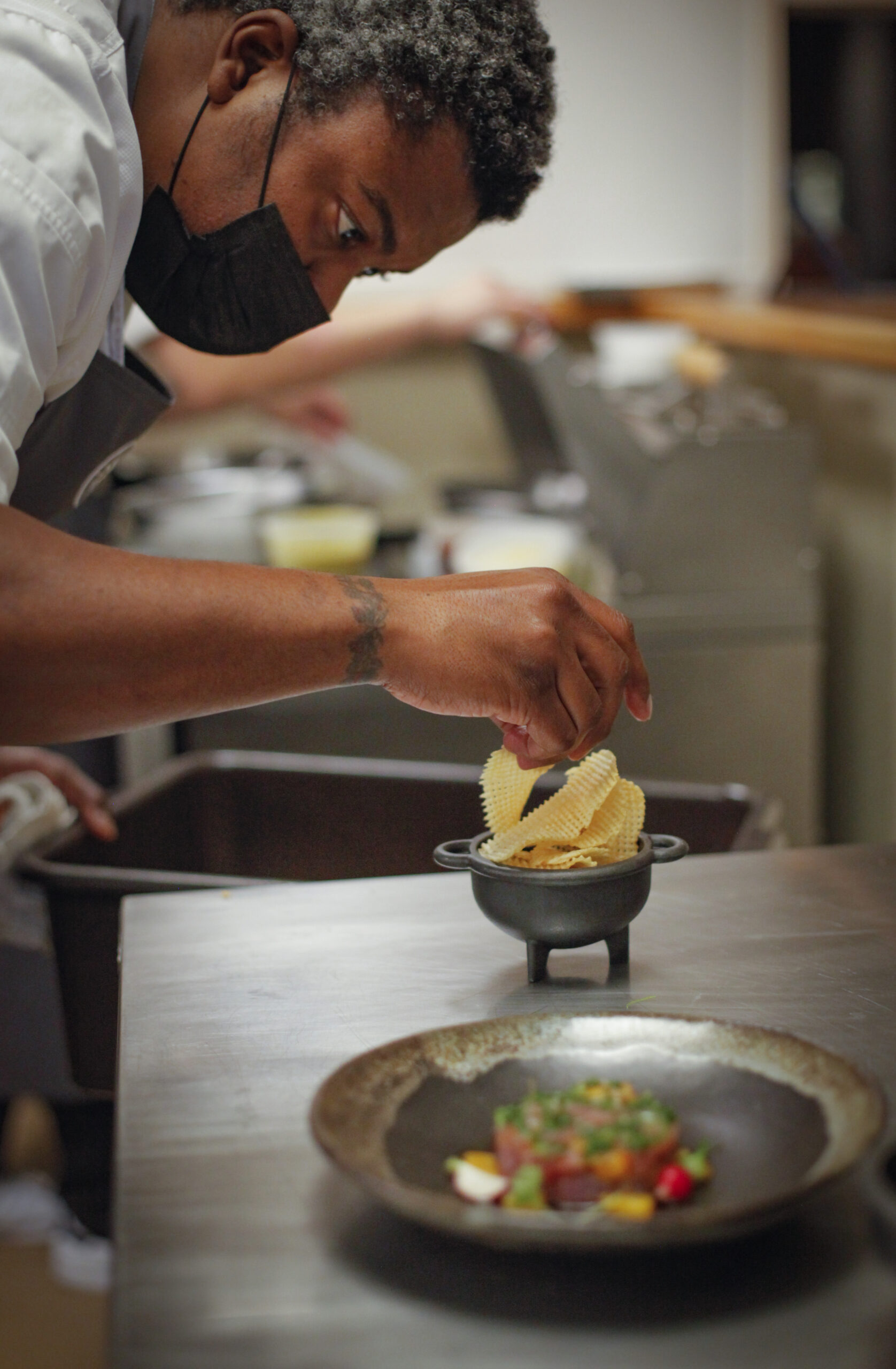 Chef Stéphane Saint Louis puts finishing touches on a dinner dish at Table Culture Provisions on Friday, January 21, 2022._Petaluma, CA, USA._(CRISSY PASCUAL/ARGUS-COURIER STAFF)