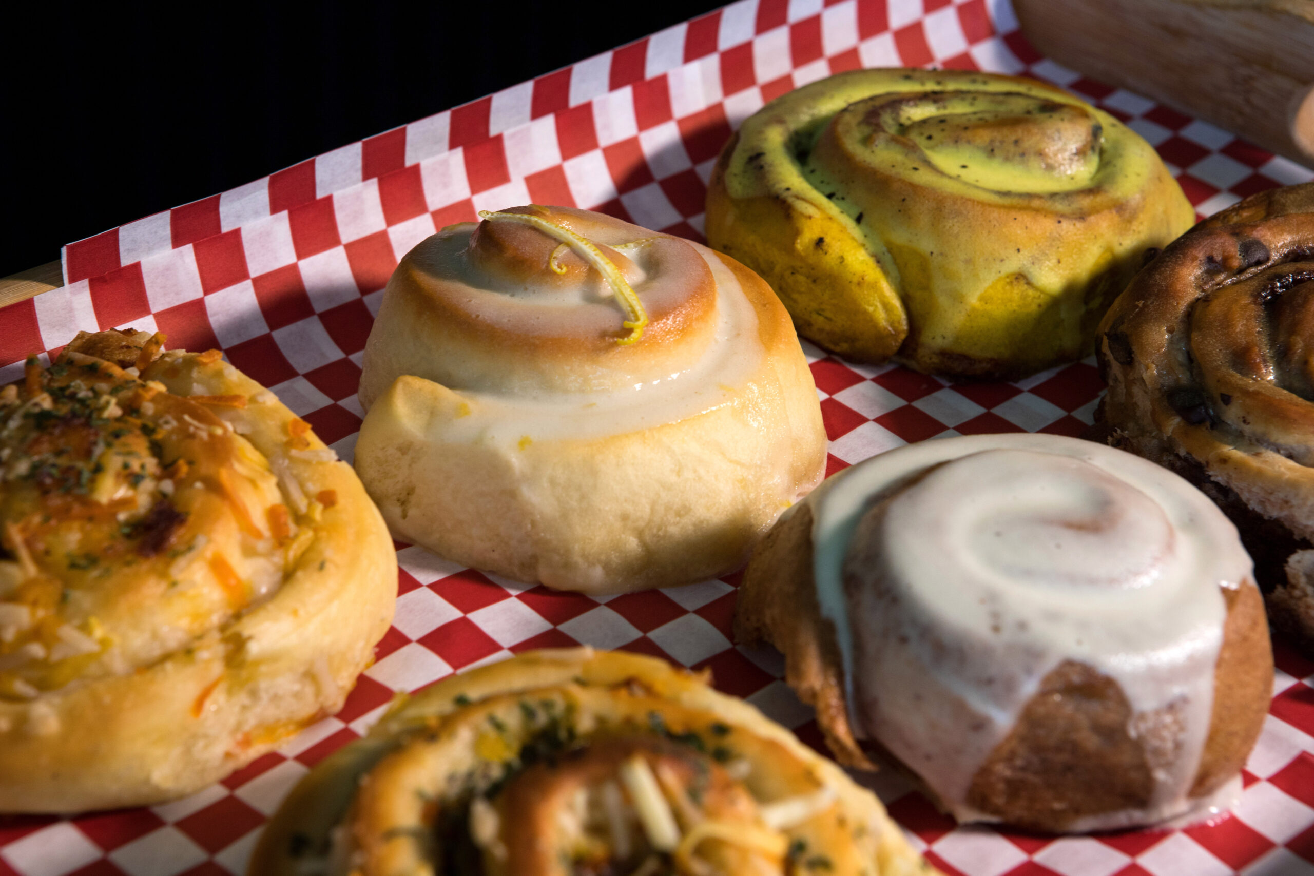 A Lemon roll with lemon frosting, is top center, next to other sweet and savory treats, at Magdelena's Savories & Sweets, in Petaluma, Calif., on Saturday, February 19, 2022. (Photo by Darryl Bush / For The Press Democrat)