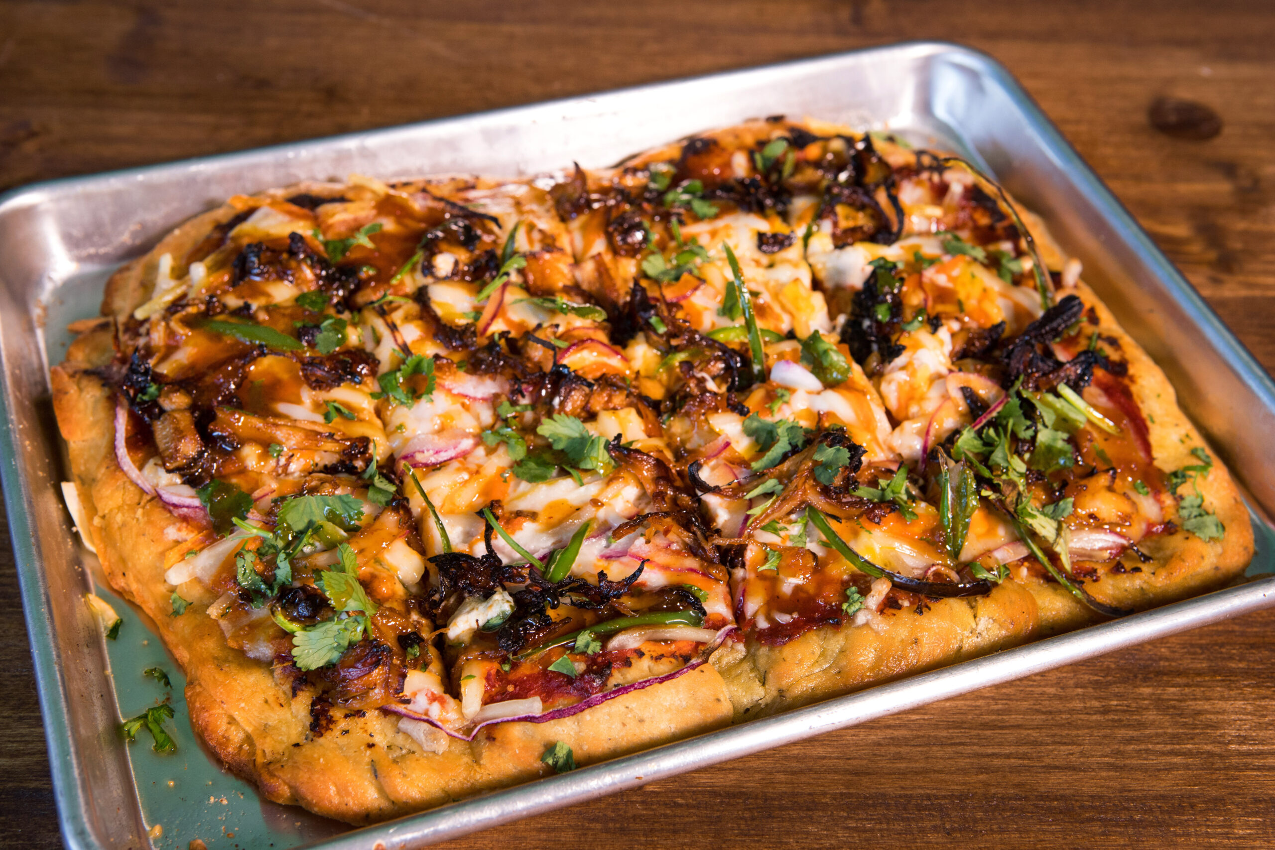 A vegan sheet pan pizza called "Korean BBQ Pulled Shrooms" has shredded trumpet mushrooms, slow cooked Korean barbecue sauce, red onion and chilies, at Magdelena's Savories & Sweets, in Petaluma, Calif., on Saturday, February 19, 2022. (Photo by Darryl Bush / For The Press Democrat)