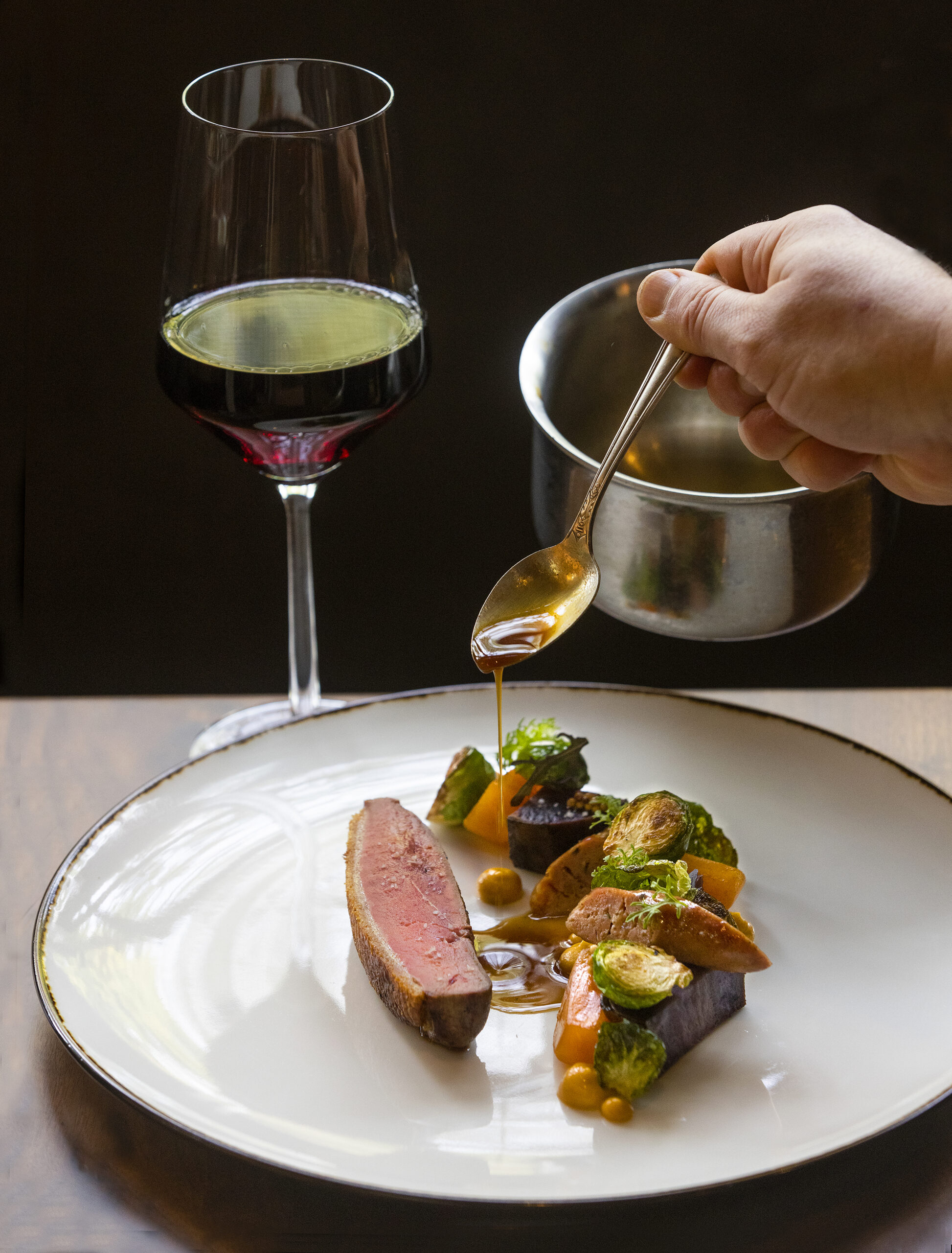 Aged Sonoma Duck with Okinawan sweet potato, persimmon and brussels sprouts from The Matheson in Healdsburg on Friday, November 5, 2021. (Photo by John Burgess/The Press Democrat)