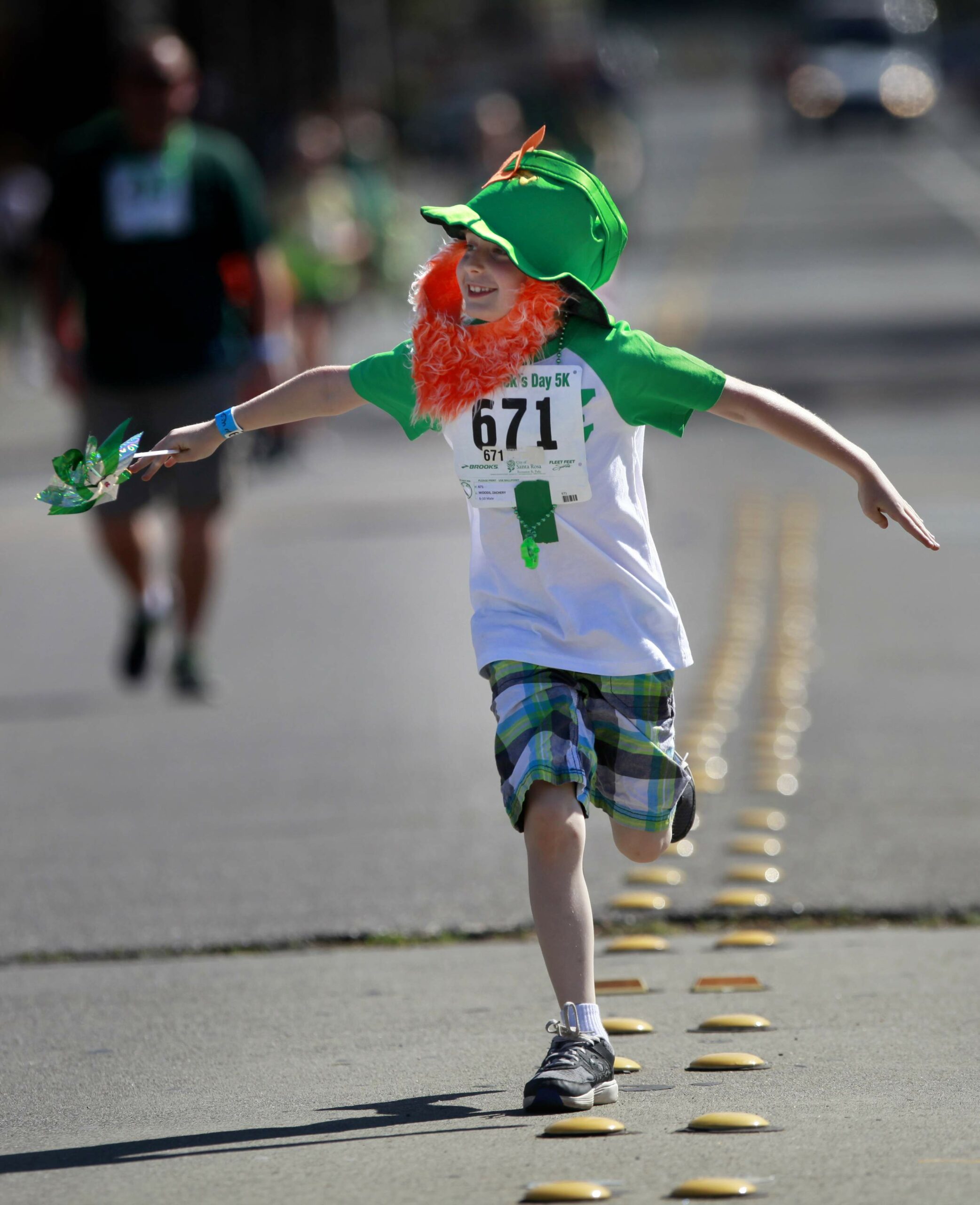 Runner Zachery Woods runs along A Street during the St. Patrick's Day 5K in Santa Rosa, on Sunday, March 16, 2014. (BETH SCHLANKER/ The Press Democrat)