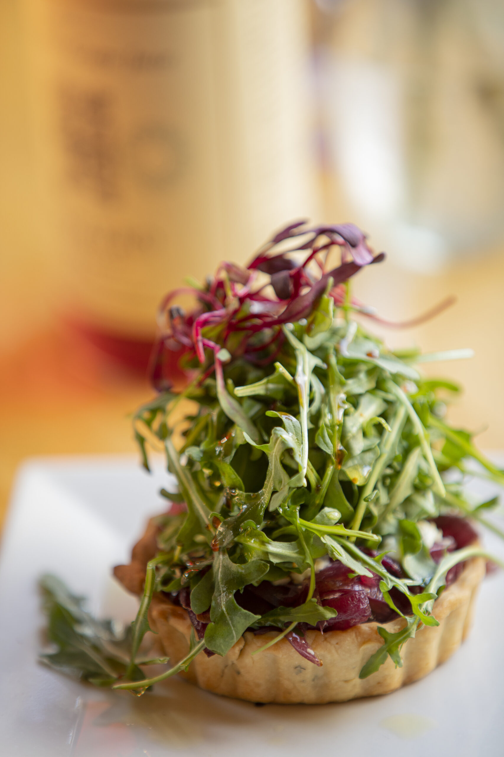 Caramelized Onion Tart, Arugula, goat cheese, olive oil and balsamic combine to create this dish at Cafe Trillium in Mendocino.