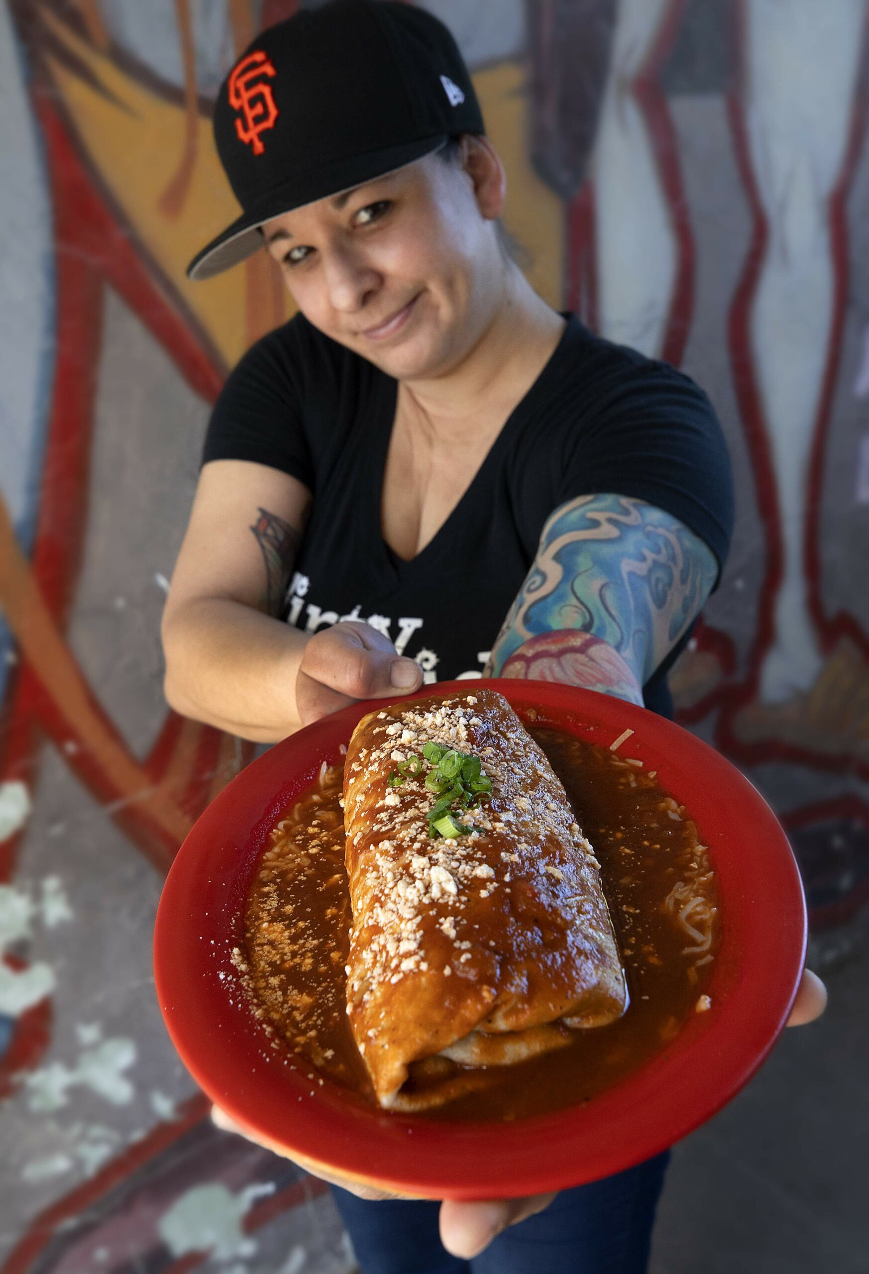 Second-generation owner Kate Bruno with the Big Ranch carne asada burrito from Juanita Juanita in Sonoma. (John Burgess/The Press Democrat)