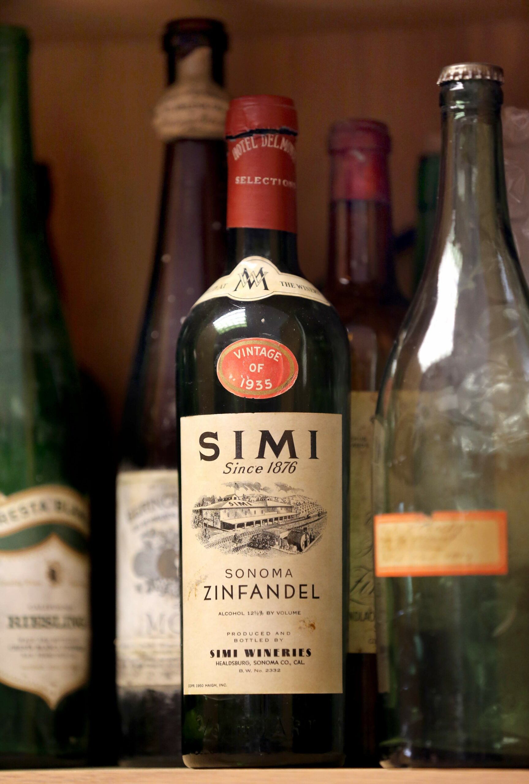 A bottle of 1935 zinfandel from Simi Winery in a collection of vintage wine bottles at the Sonoma County Wine Library in Healdsburg on Tuesday, March 19, 2019. (BETH SCHLANKER/ The Press Democrat)