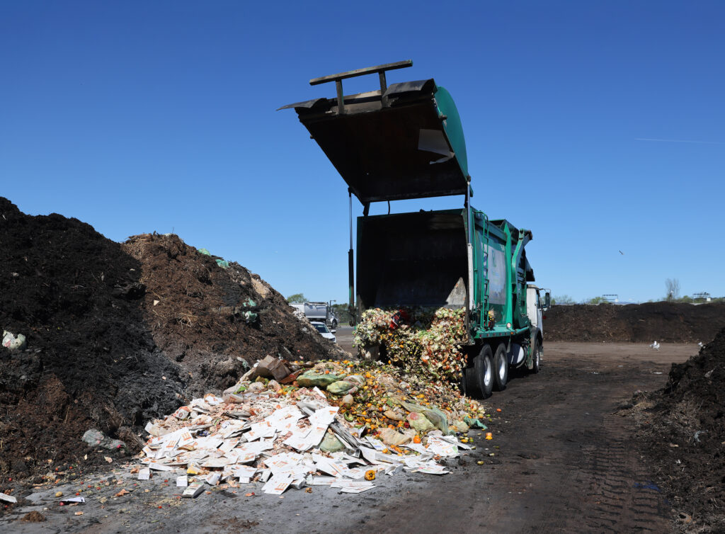 Organic materials from commercial compost bins are unloaded at the Recology waste facility in American Canyon, Calif., on Tuesday, March 22, 2022.(Beth Schlanker/The Press Democrat)
