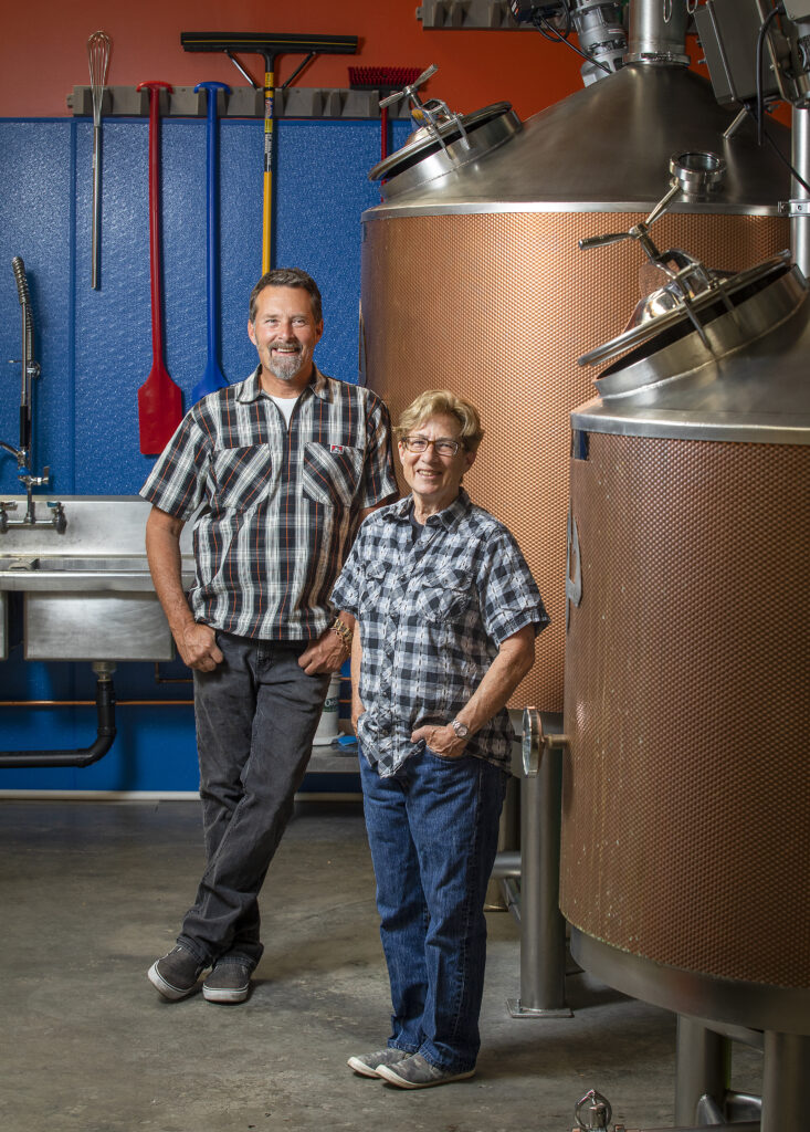 Gail Coppinger, right, and Scott Woodson, owners of Elk Fence Distillery, make Fir Top Gin, The Briny Deep Whiskey and White Elk Vodka in the only distillery in Santa Rosa. (John Burgess / The Press Democrat)