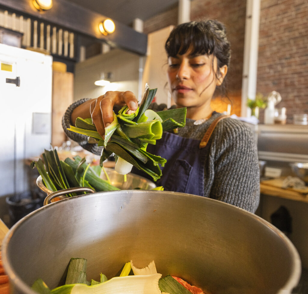 Dalia Hernandez, owner of the Naked Pig in Santa Rosa, uses the bottom of her leeks for her frittata recipes and adds the green tops to the pork bones in her bone broth. (John Burgess/Sonoma Magazine)