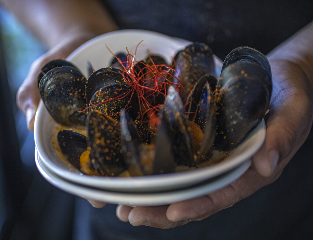 Mussels in coconut cream sauce at Kancha Champagne Bar & Tapas in downtown Santa Rosa. (Chad Surmick / The Press Democrat)