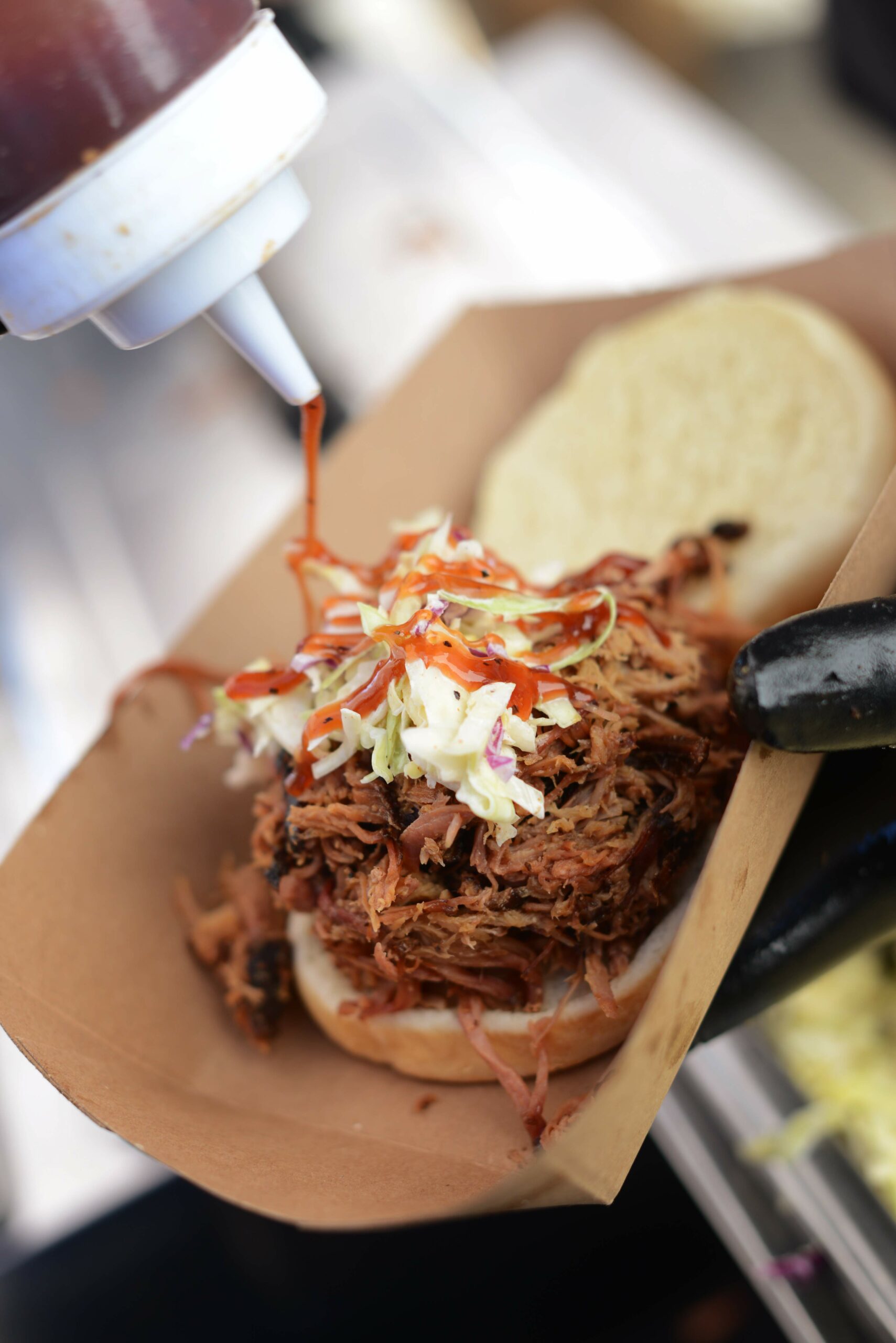 A pulled pork sandwich prepared by Camacho's during the RateBeer Best International Beer Festival held at the Sonoma County airport on Sunday, Jan. 31, 2016. (Erik Castro / for The Press Democrat)