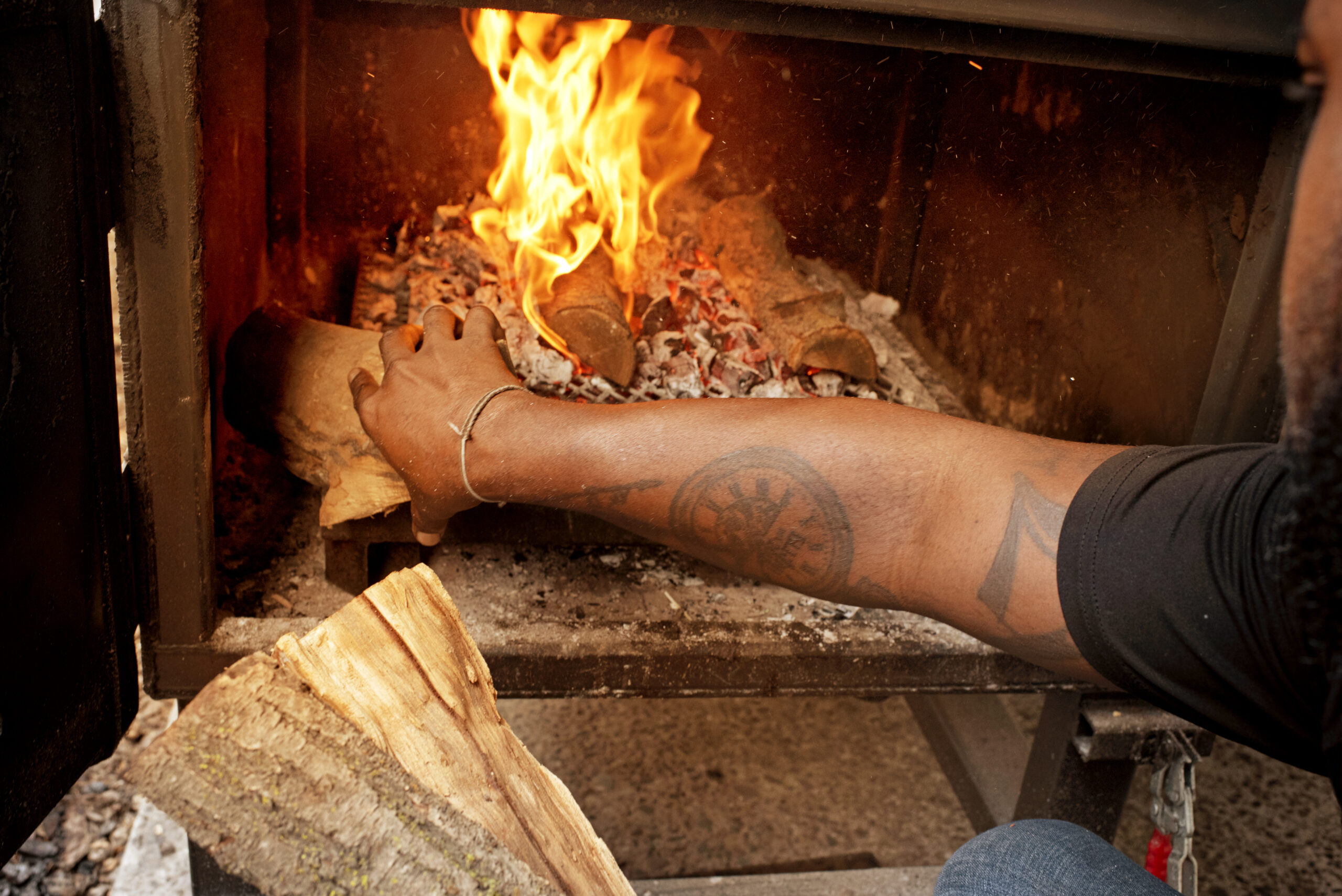 Kris Austin of Austin's Southern Smoke BBQ uses a blend of white oak and almond wood for creating his bar-b-que at Old Possum Brewing Co. in Santa Rosa, California on May 5, 2022. (Photo: Erik Castro/for Sonoma Magazine)