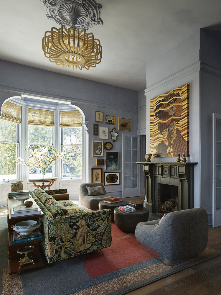 Light now streams into this sitting room filled with art and a sofa with foxes and rabbits in the Aesthetic style of 19th century England. (Matthew Millman)