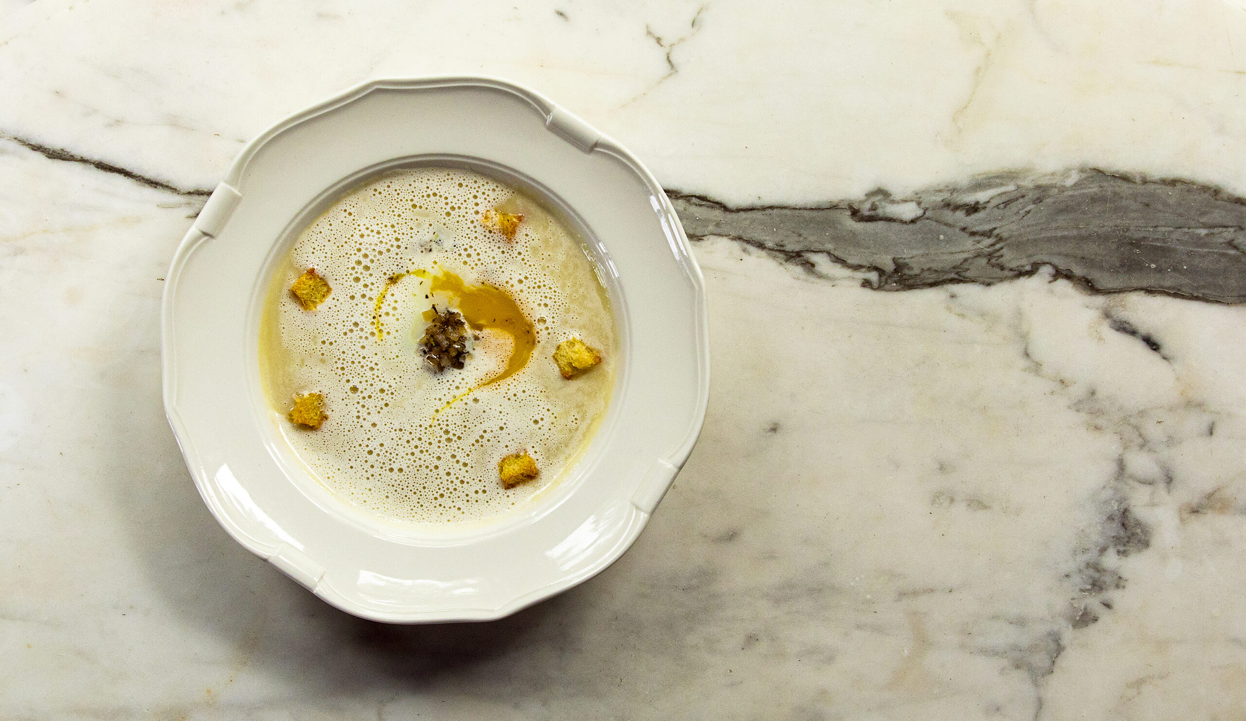 Onion Velouté with slow cooked egg, croutons, Banyuls vinegar, and parmeggiano-Reggiano from The Madrona in Healdsburg Friday, June 3, 2022. (John Burgess / The Press Democrat)