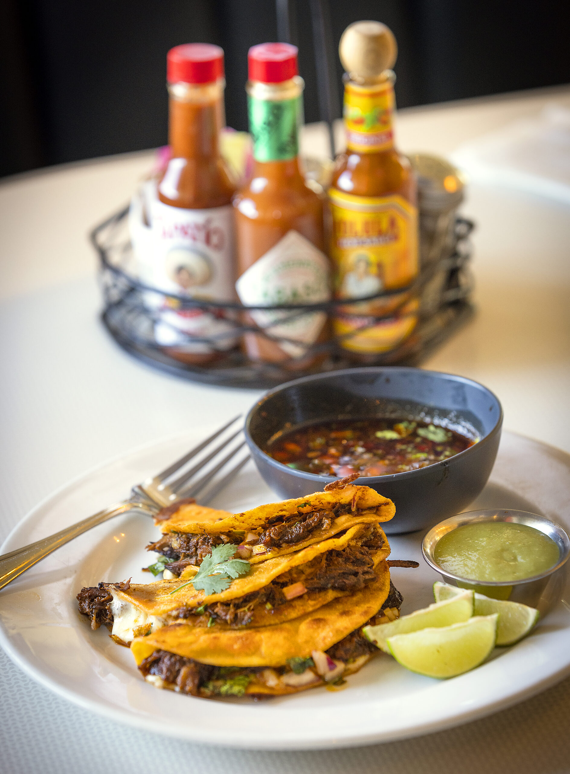 Birria Tacos with adobo marinated beef served with consomé from Kinas Kitchen & Bar in Sonoma. (John Burgess / The Press Democrat)