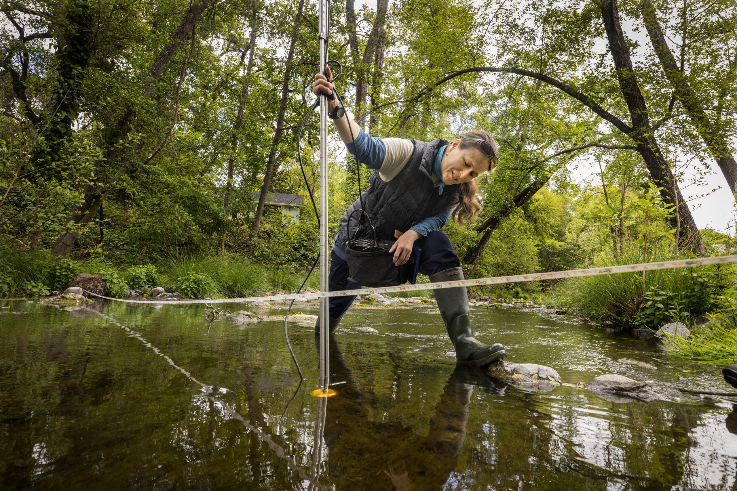 Wendy Hayes, a watershed ecologist with the Sonoma Ecology Center, measures the depth and flow of Sonoma Creek in Glen Ellen to gauge the amount of water in relation to groundwater stores. (John Burgess/Sonoma Magazine)