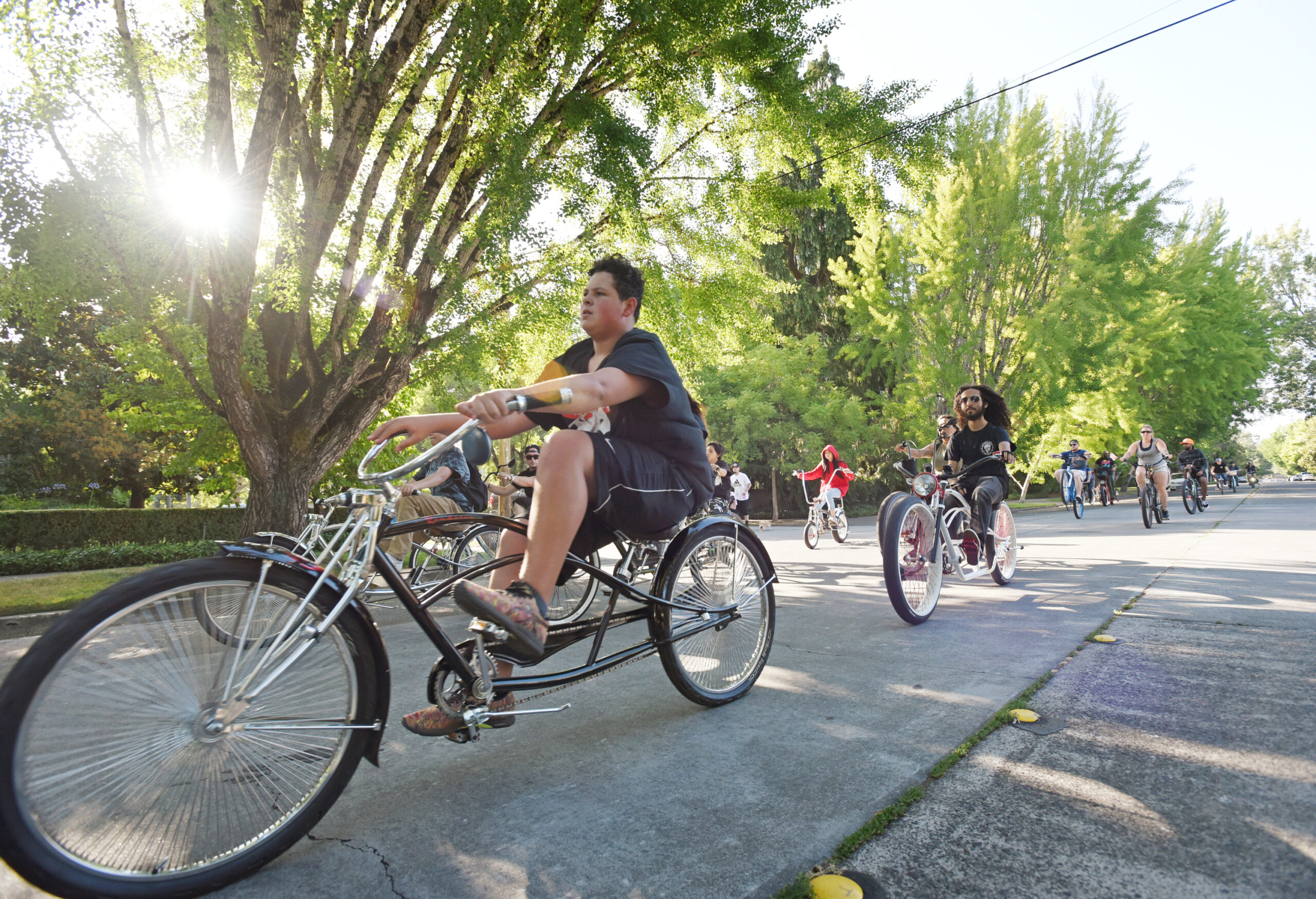 Riders heading down McDonald Avenue on their way to the taco trucks in the Roseland neighborhood during the Santa Rosa Taco Tuesday Bike Ride in Santa Rosa. (Erik Castro/For The Press Democrat)