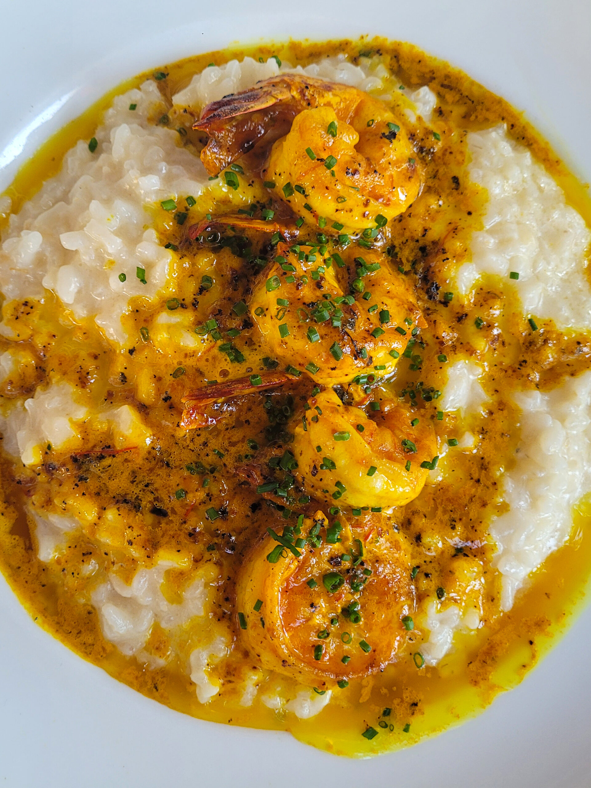 Shrimp and Saffron Risotto is served at Grata Italian Eatery in Windsor. (Heather Irwin / The Press Democrat)