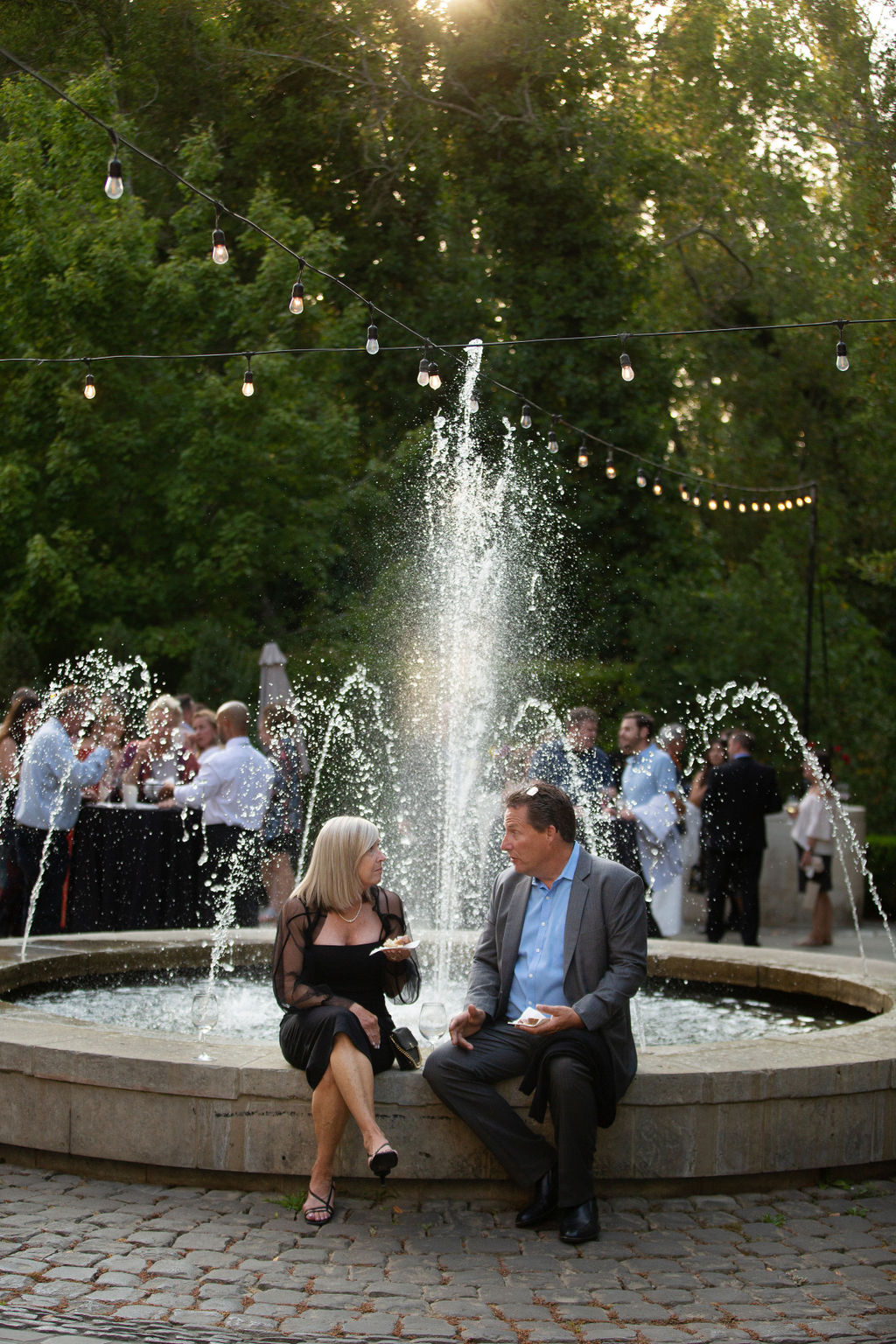 David and Diane LaMonica, owners of Salt and Stone Restaurant, enjoy a bite to eat in front of the fountain at the Sonoma Magazine 10th Anniversary Party at Buena Vista Winery in Sonoma, CA. The event took place on July 28, 2022. (Photo by Charlie Gesell)