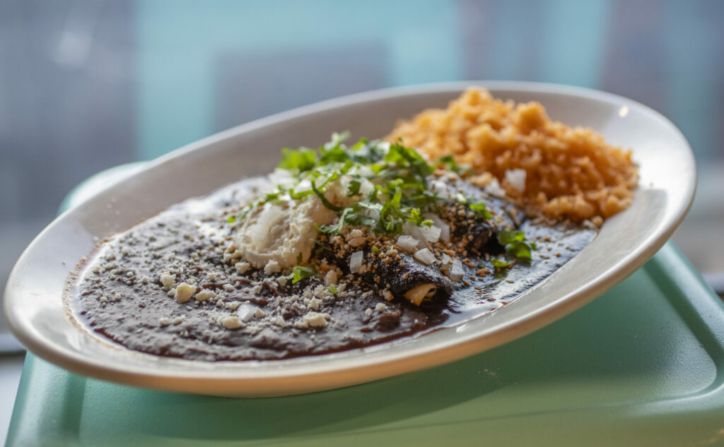 The chicken mole enchilada by chef Efrain Balmes at Sonoma Eats in Sonoma Tuesday November 22, 2022. (Chad Surmick / Press Democrat)