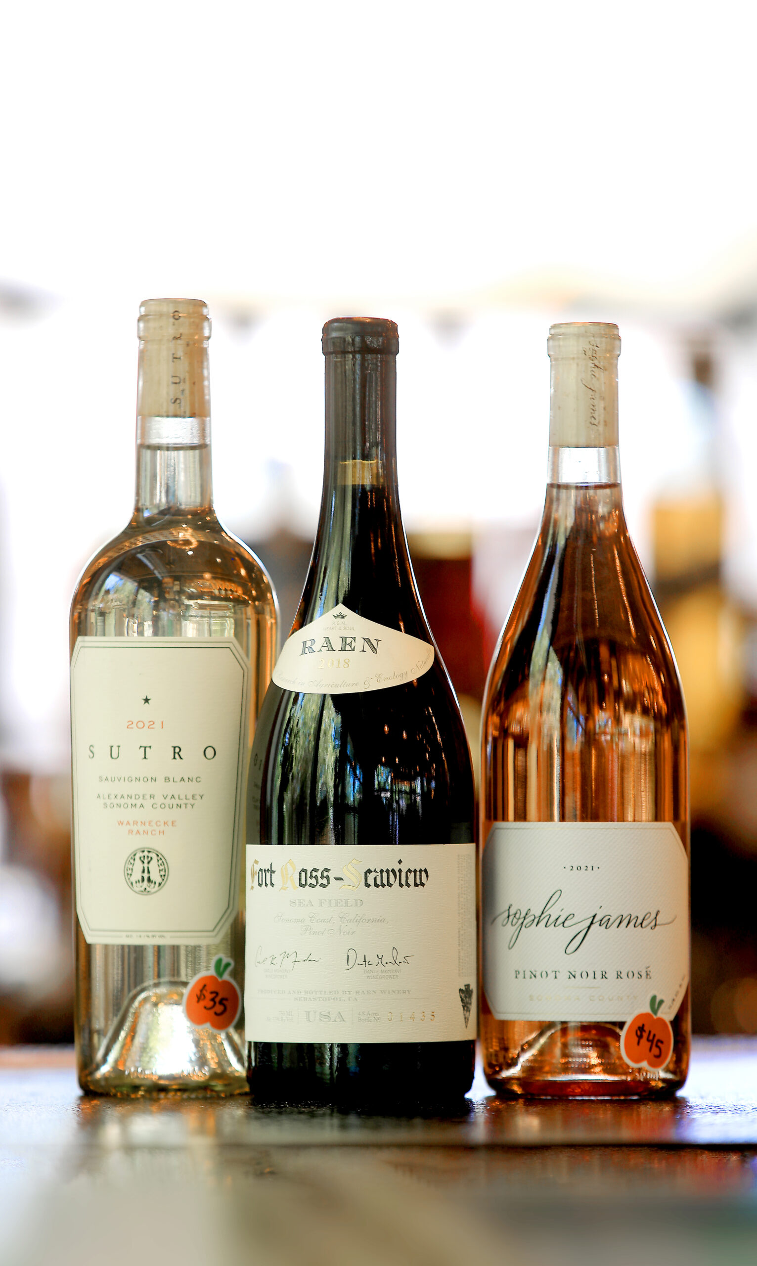 From left, 2021 Sutro, Sauvignon Blanc, Warnecke Ranch; 2018 RAEN, 'Sea Field' Fort Ross Seaview, Pinot Noir; 2021 Sophie James, Rose of Pinot Noir, Sonoma. (Kent Porter / The Press Democrat) 2022