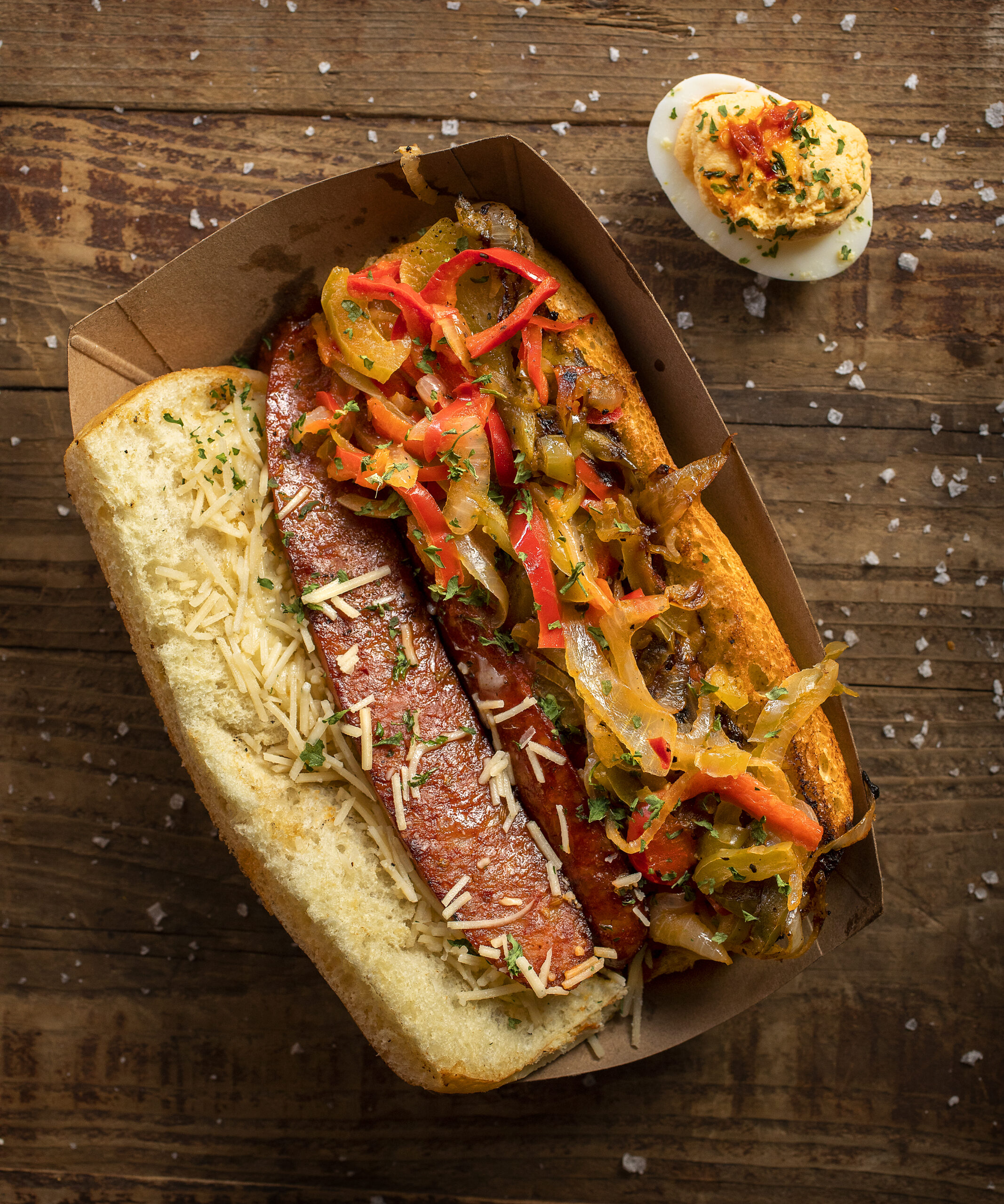 The Sausage and Peppers Sandwich with a Spicy Deviled Egg from Canevari?s Delicatessen & Catering in Santa Rosa. (Photo by John Burgess/The Press Democrat)