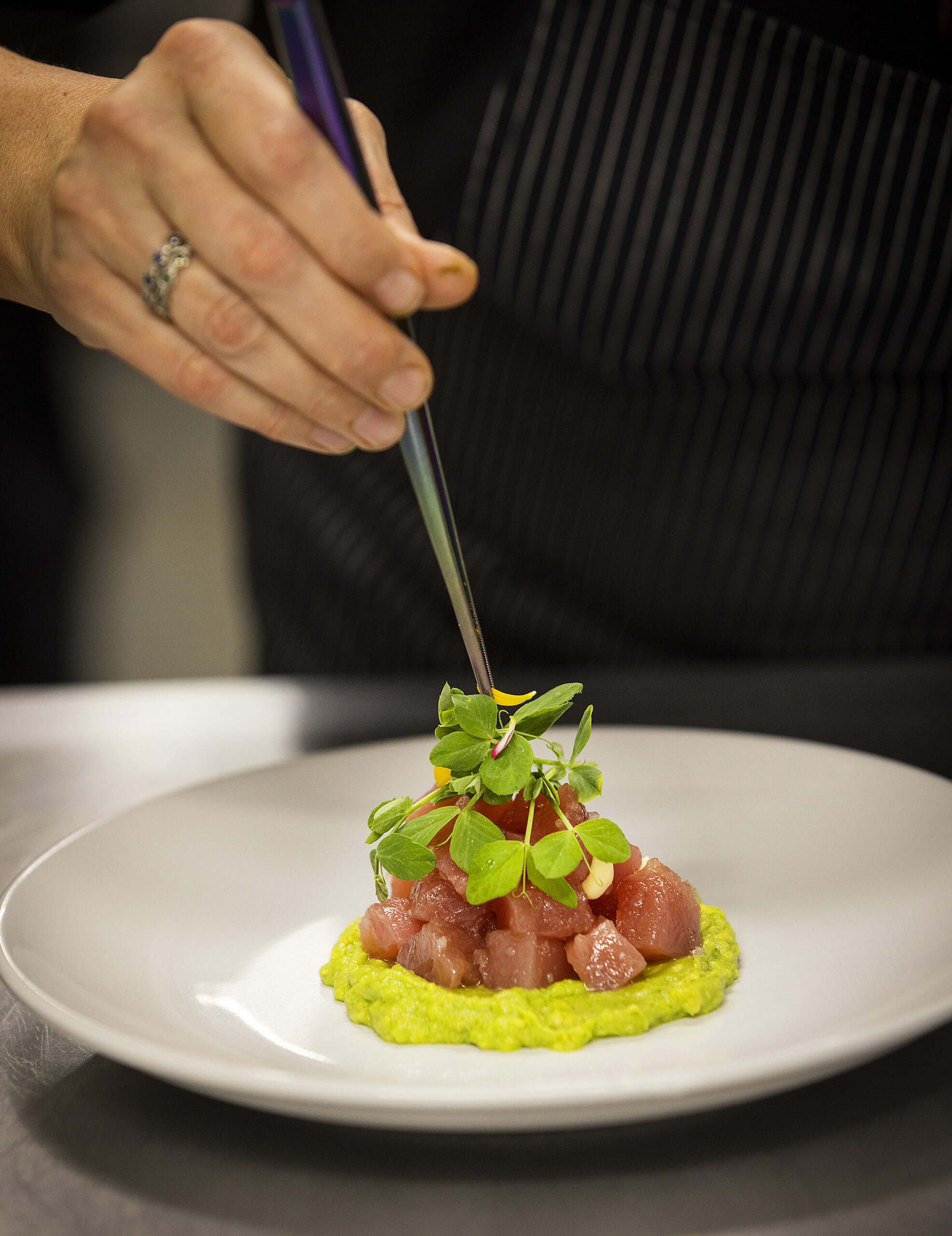 Chef Jennifer McMurry plates Sushi Grade Ahi Tuna over avocado from Kivelstadt Cellars and WineGarten at the corner of Hwy 12 and Hwy 121 in Sonoma Thursday, October 20, 2022. (John Burgess/The Press Democrat)