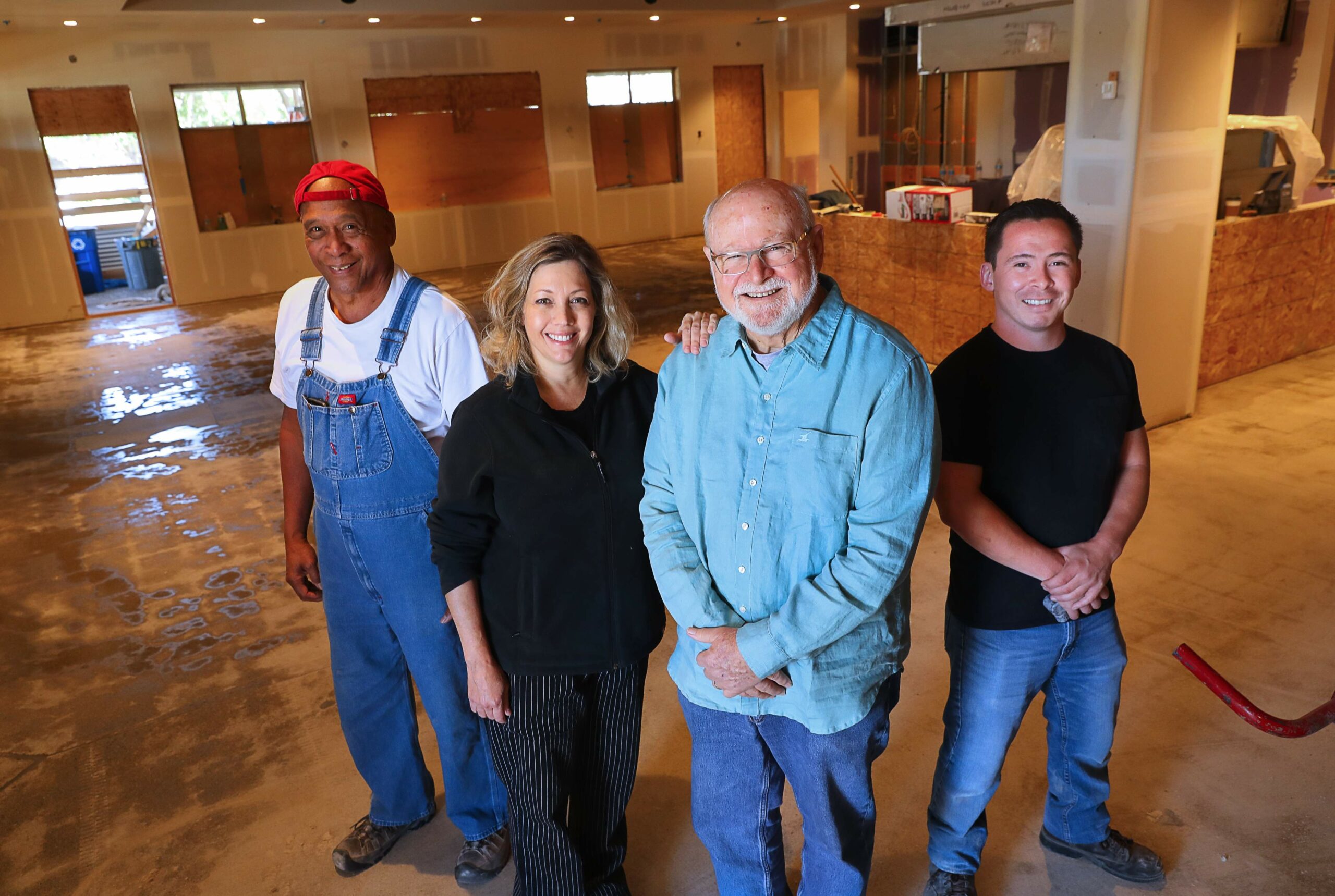 Sweet T's Restaurant & Bar owners Ann and Dennis Tussey, center, along with working partner George Ah Chin, left, and manager Robert Zenobi, right, at the site of their new Windsor location before construction was completed. The couple lost their Santa Rosa restaurant in the 2017 Tubbs fire. (Christopher Chung / The Press Democrat)