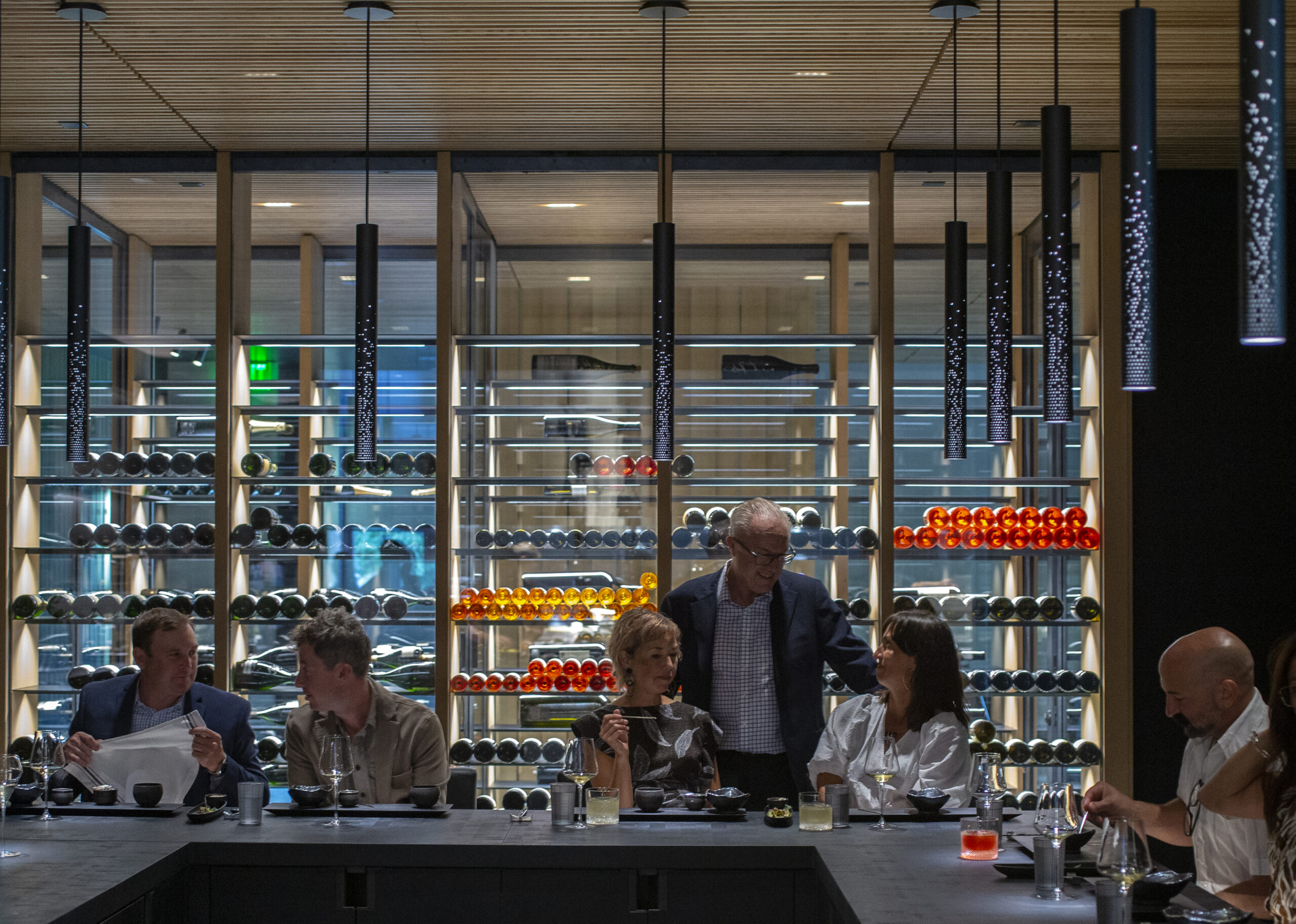 Guests enjoy the Kitchen Table while chatting with Maitre'd Hotel / Owner Nick Peyton at Cyrus in Geyserville. (Chad Surmick/The Press Democrat)