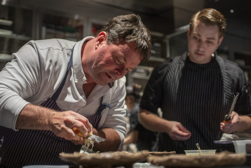 During a family and friends pre-opening night, Chef Doug Keane works the kitchen at Cyrus in Geyserville. (Chad Surmick/The Press Democrat)