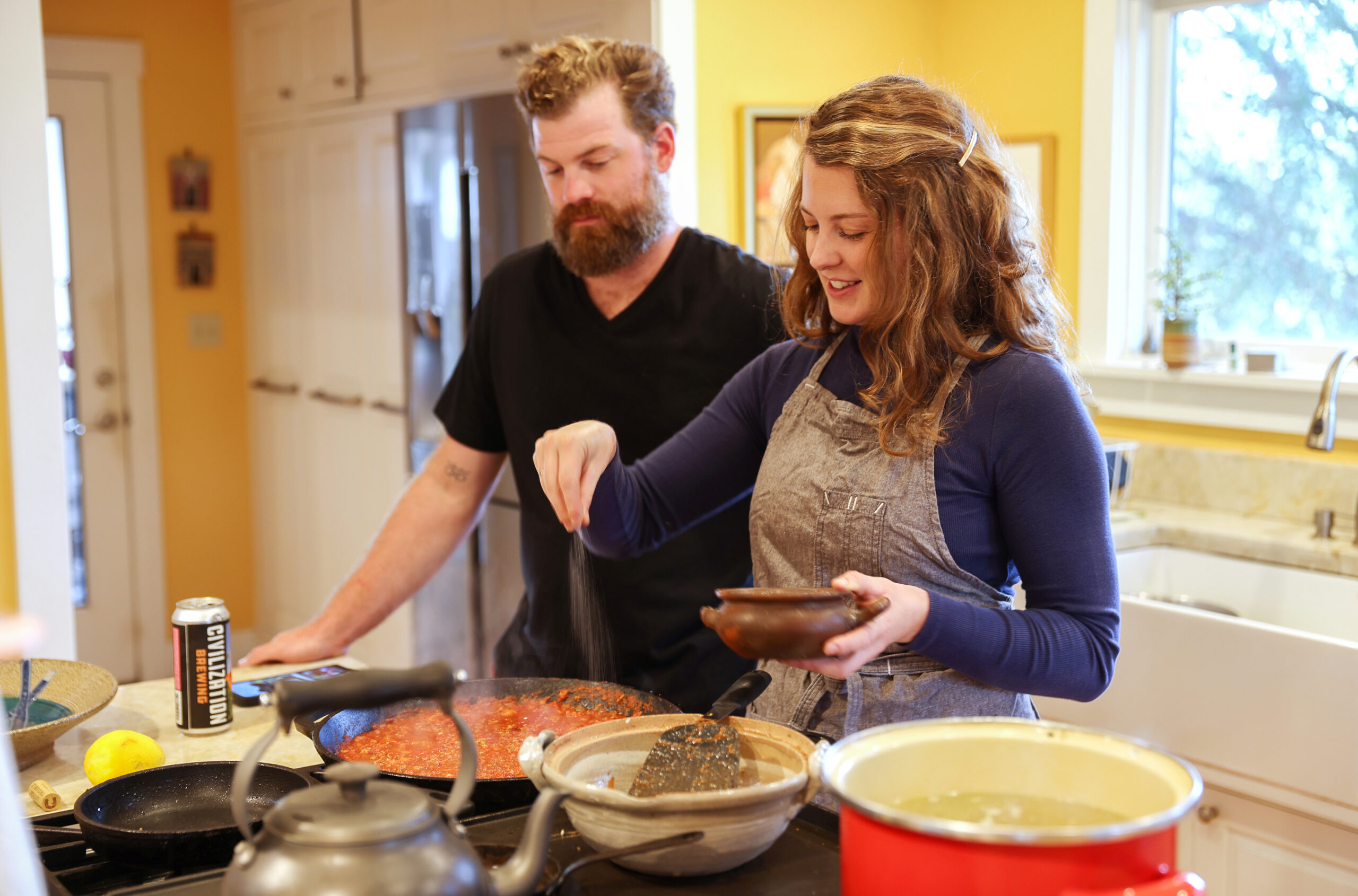 Siblings Eric and Jennifer Reichardt prepare Duck Sugo Cavatelli at their father’s home in Petaluma. (Christopher Chung/The Press Democrat)