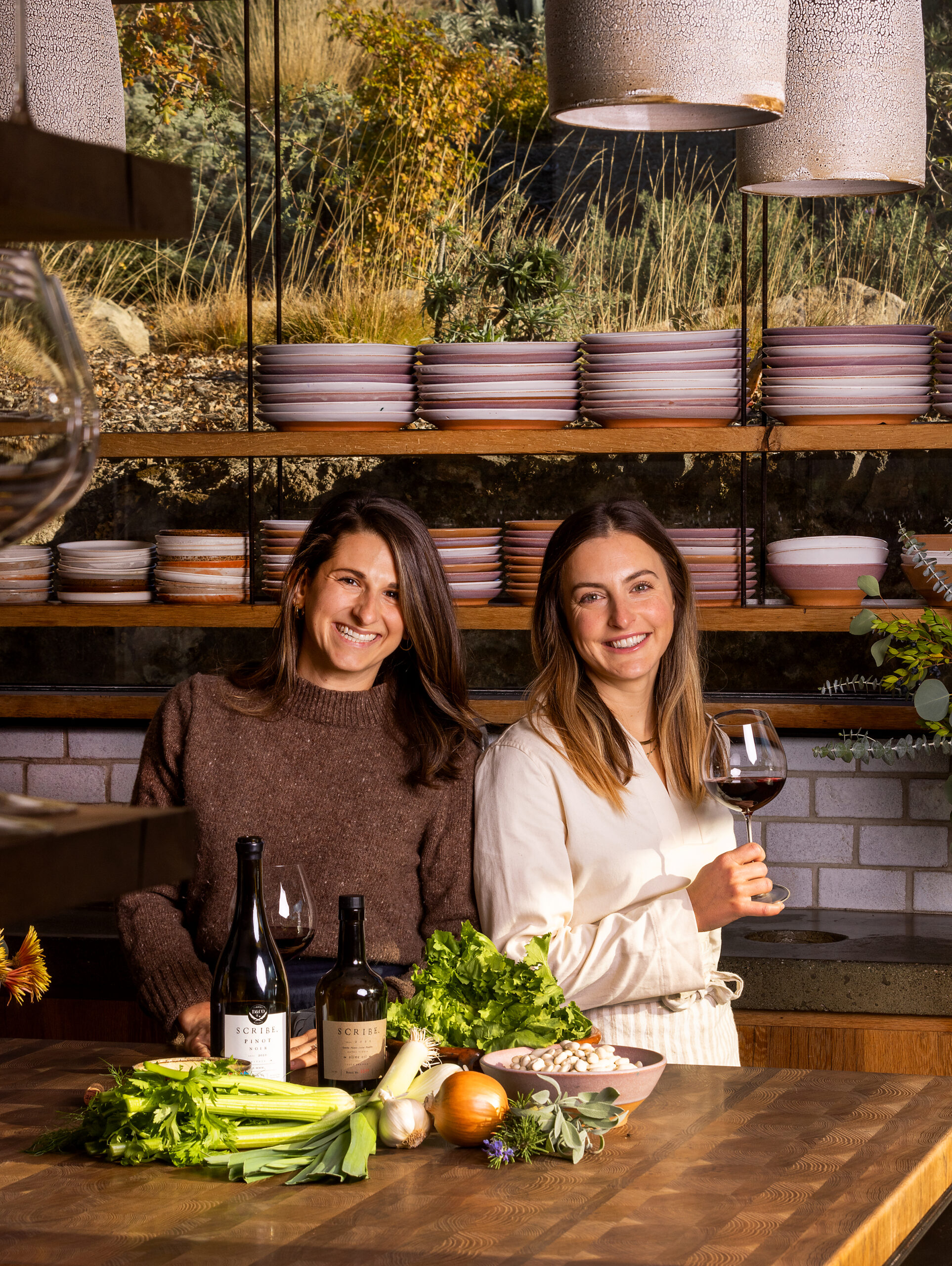 Kelly Mariani, culinary director/co-owner of Scribe Winery, right, and chef Kirsten Watley prepare their Vegetarian Escarole and White Bean Soup in the Scribe Kitchen, Sonoma November 29, 2022. (John Burgess/Press Democrat)