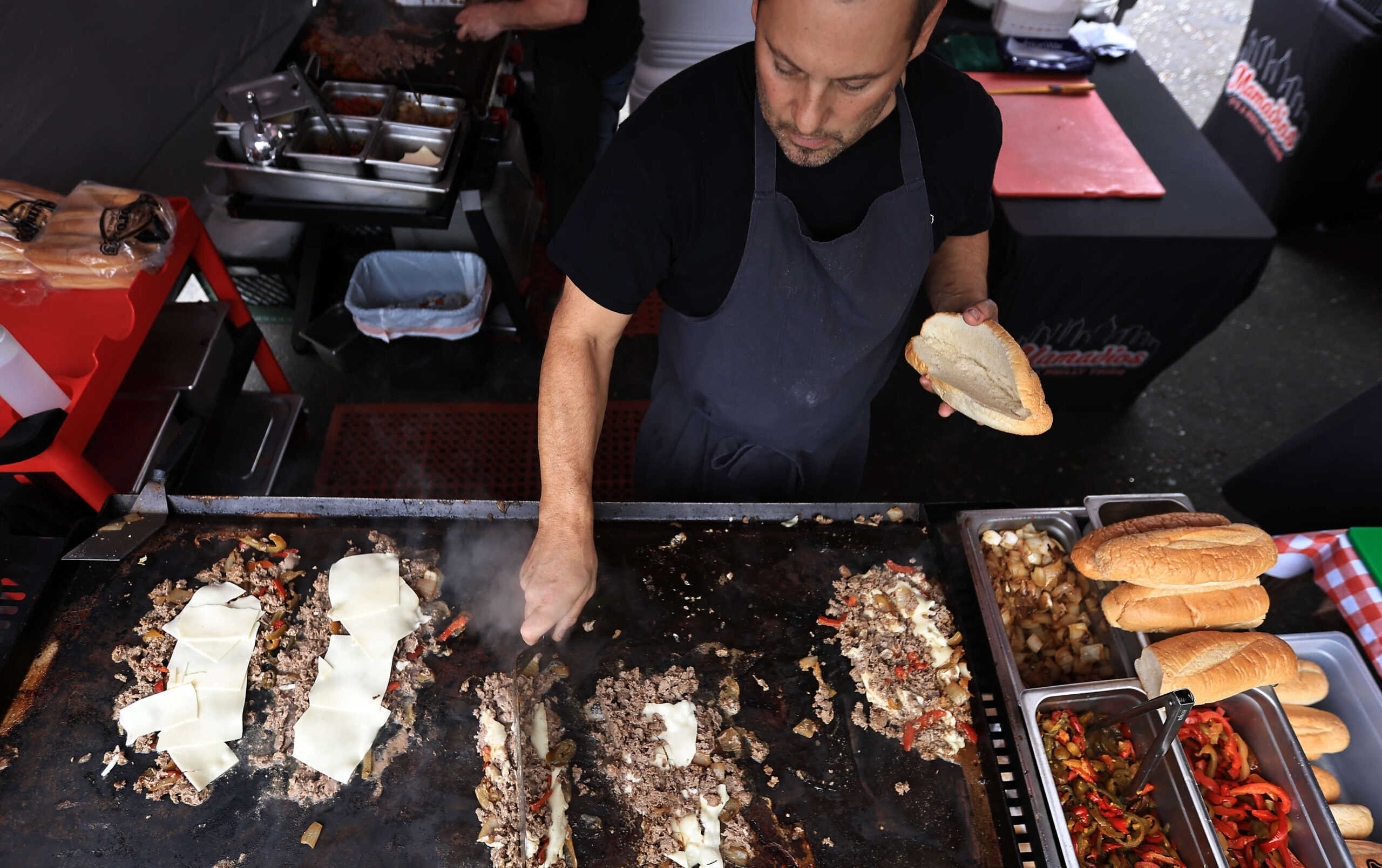 Chris Amadio, owner of Mamadio's, runs multiple grills during the 2nd Annual Cheesesteak Festival at Parliament Brewing Company in Rohnert Park, Saturday, March 22, 2025. (Kent Porter / The Press Democrat)
