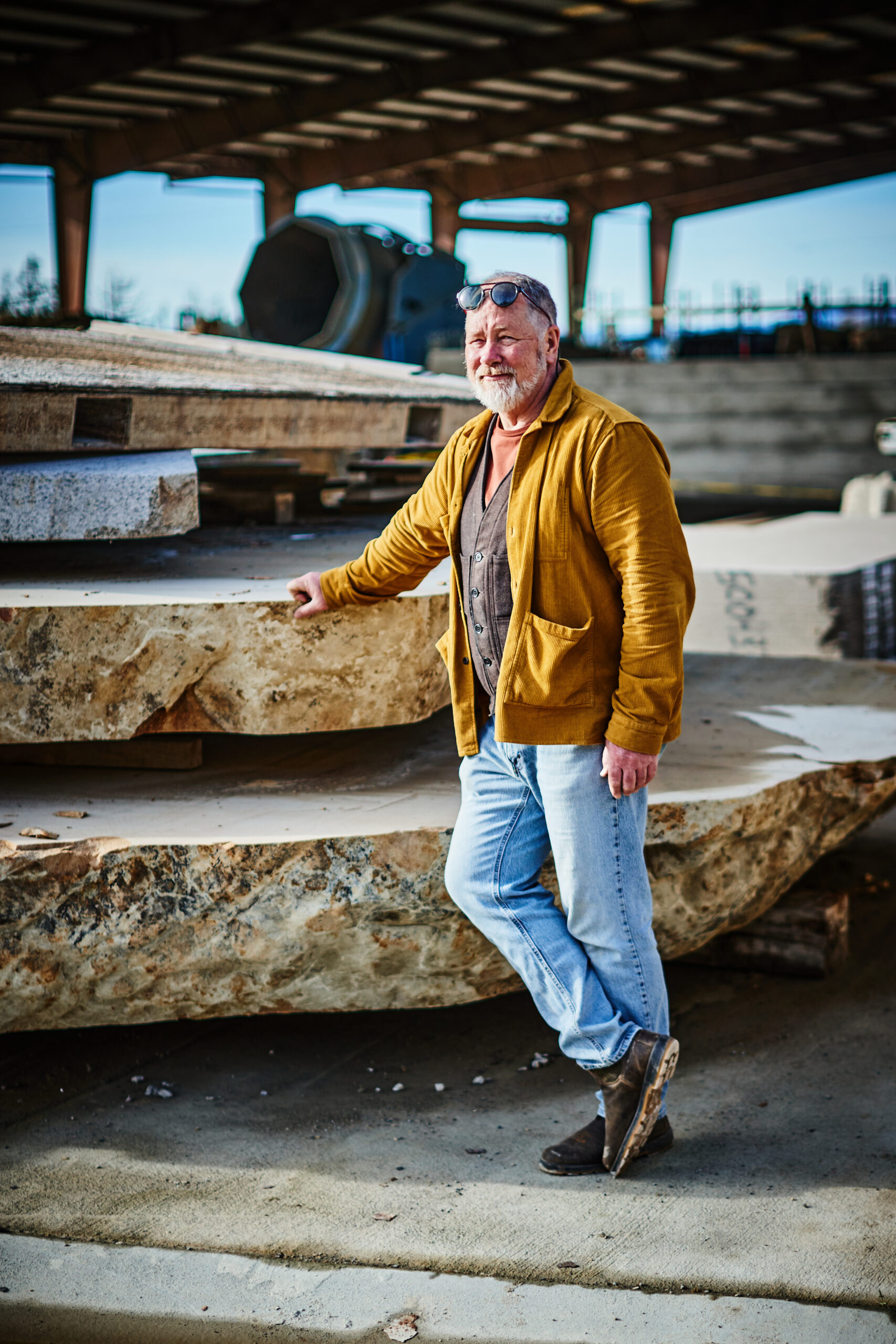 The artist with slices of a 400-ton limestone boulder, part of a massive (and secret) future project. (Kim Carroll/For Sonoma Magazine)