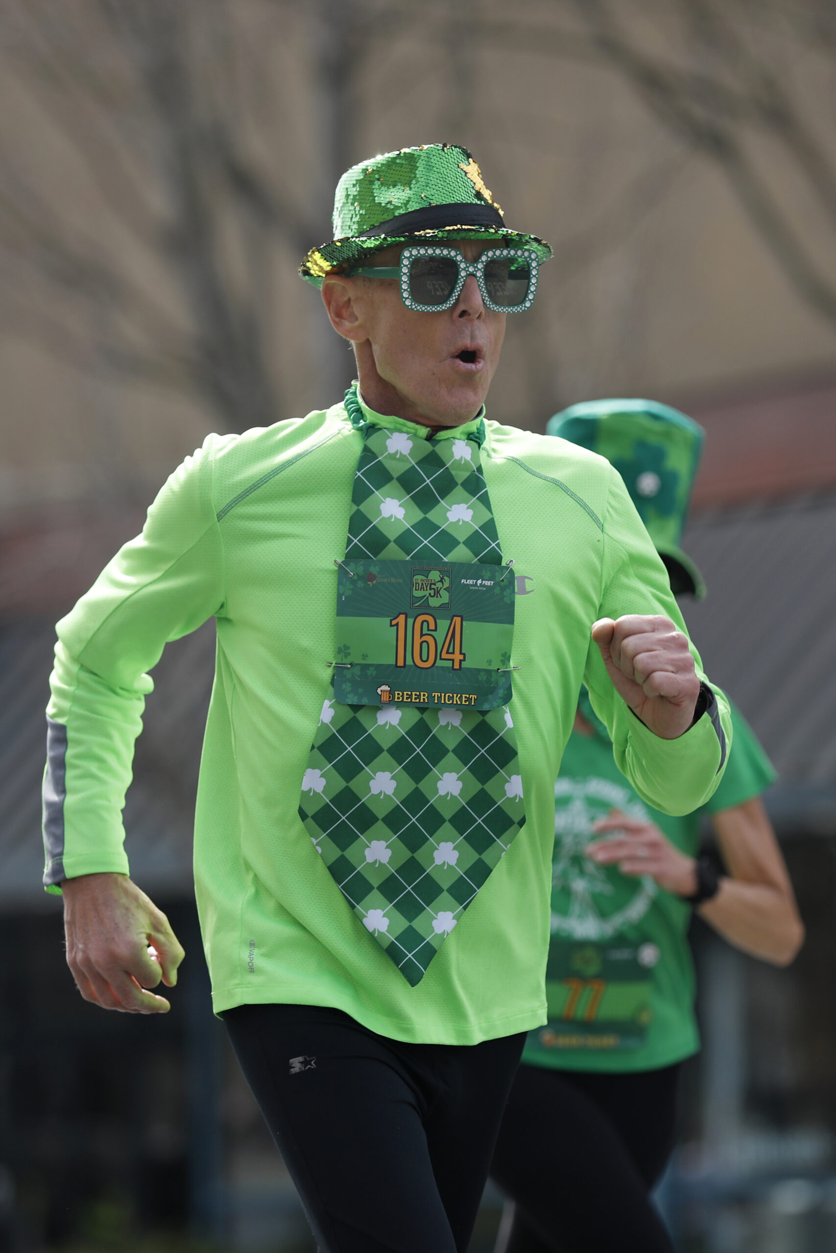 John Gerhardt runs toward the finish line of the St. Patrick's Day 5K on Santa Rosa Ave. near Old Courthouse Square in Santa Rosa, Calif., on Sunday, March 13, 2022.(Beth Schlanker/The Press Democrat)